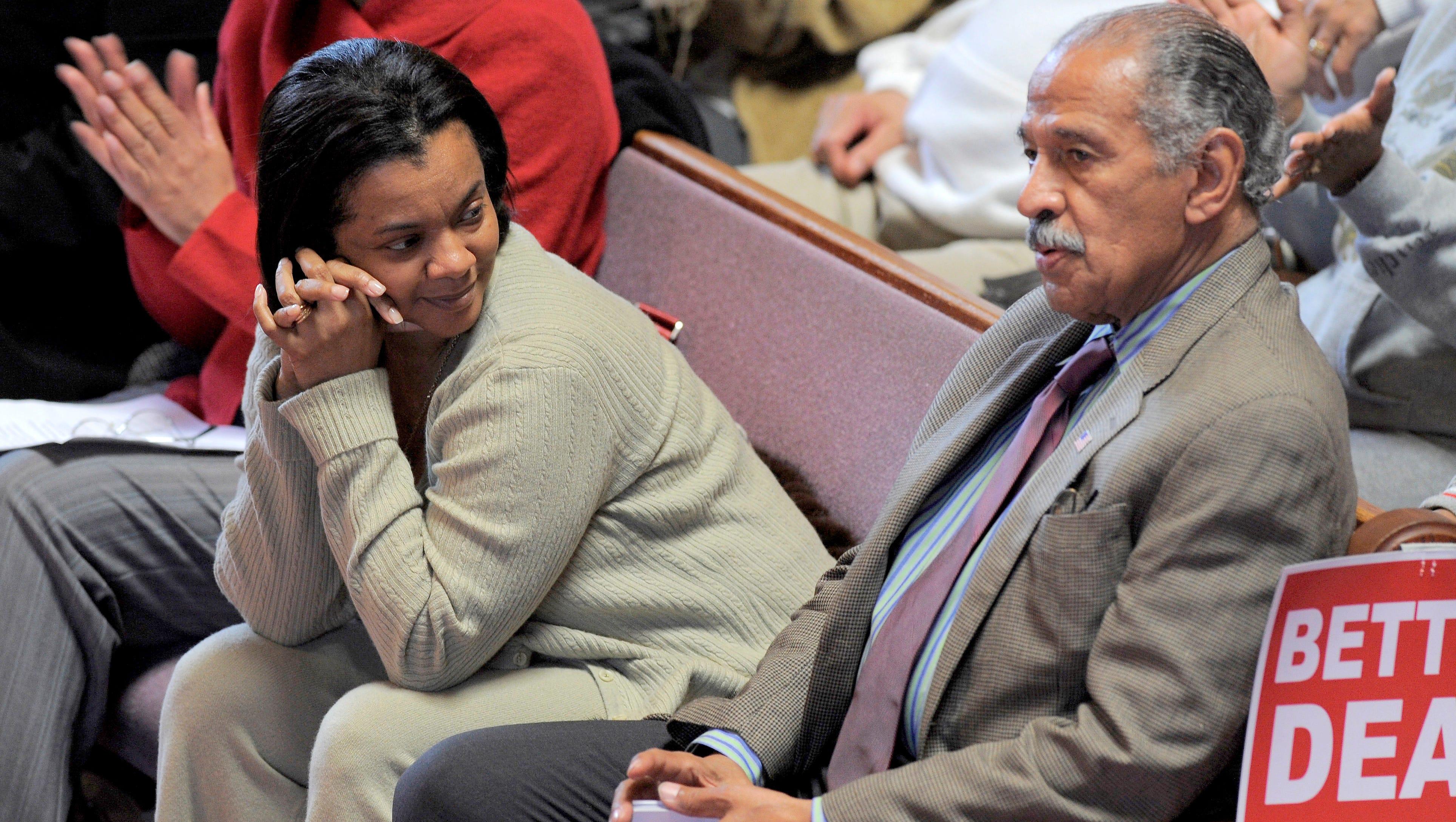 Detroit City Council President Monica Conyers looks at her husband during his introduction at a 2009 rally at Triumph Church in Detroit to oppose the Cobo expansion plan.