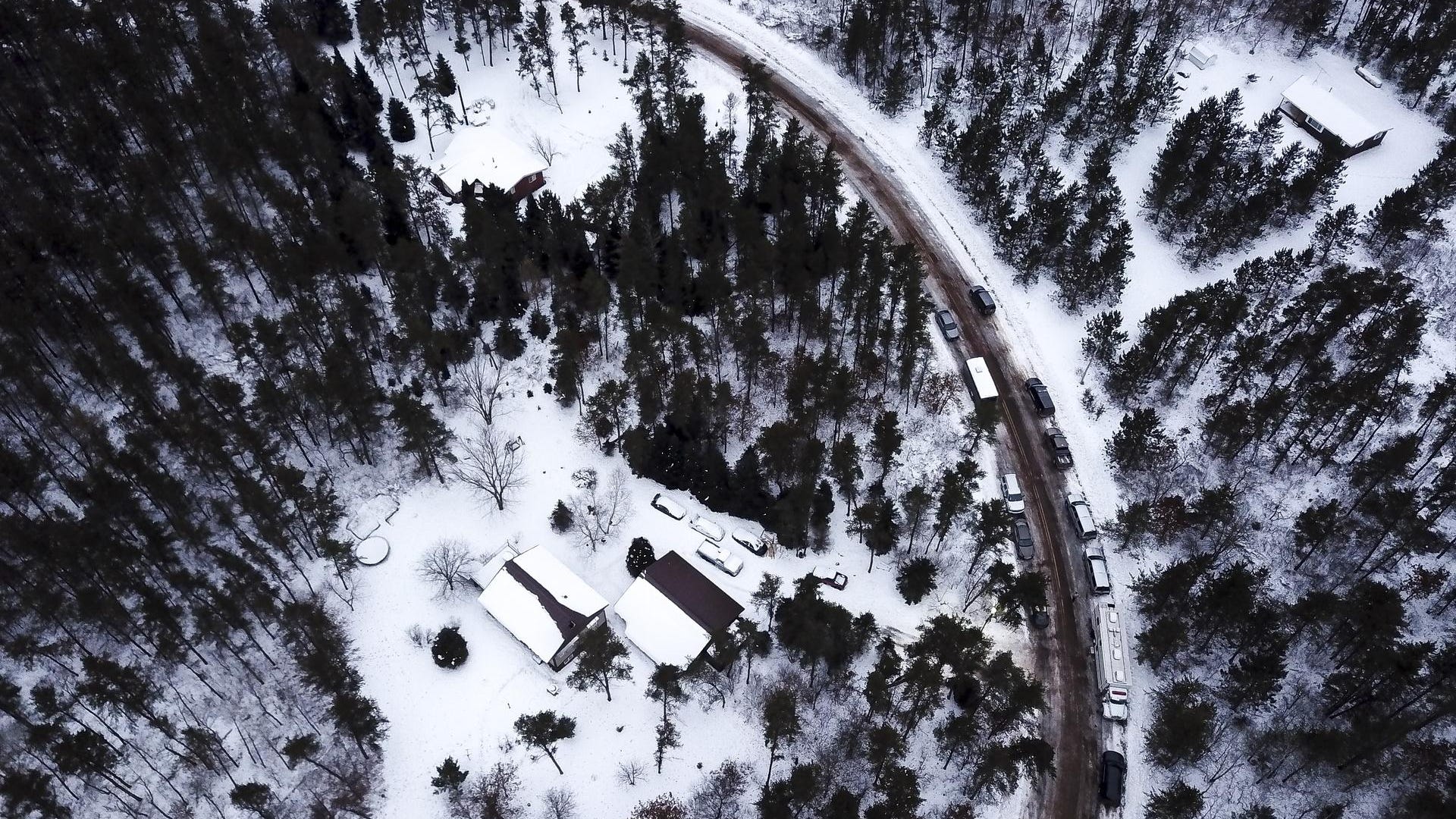 This aerial photo shows the cabin where 13-year-old Jayme Closs was held by Jake Thomas Patterson, is surrounded by law enforcement vehicles, Saturday, Jan. 12, 2019 in the town Gordon, Wis.