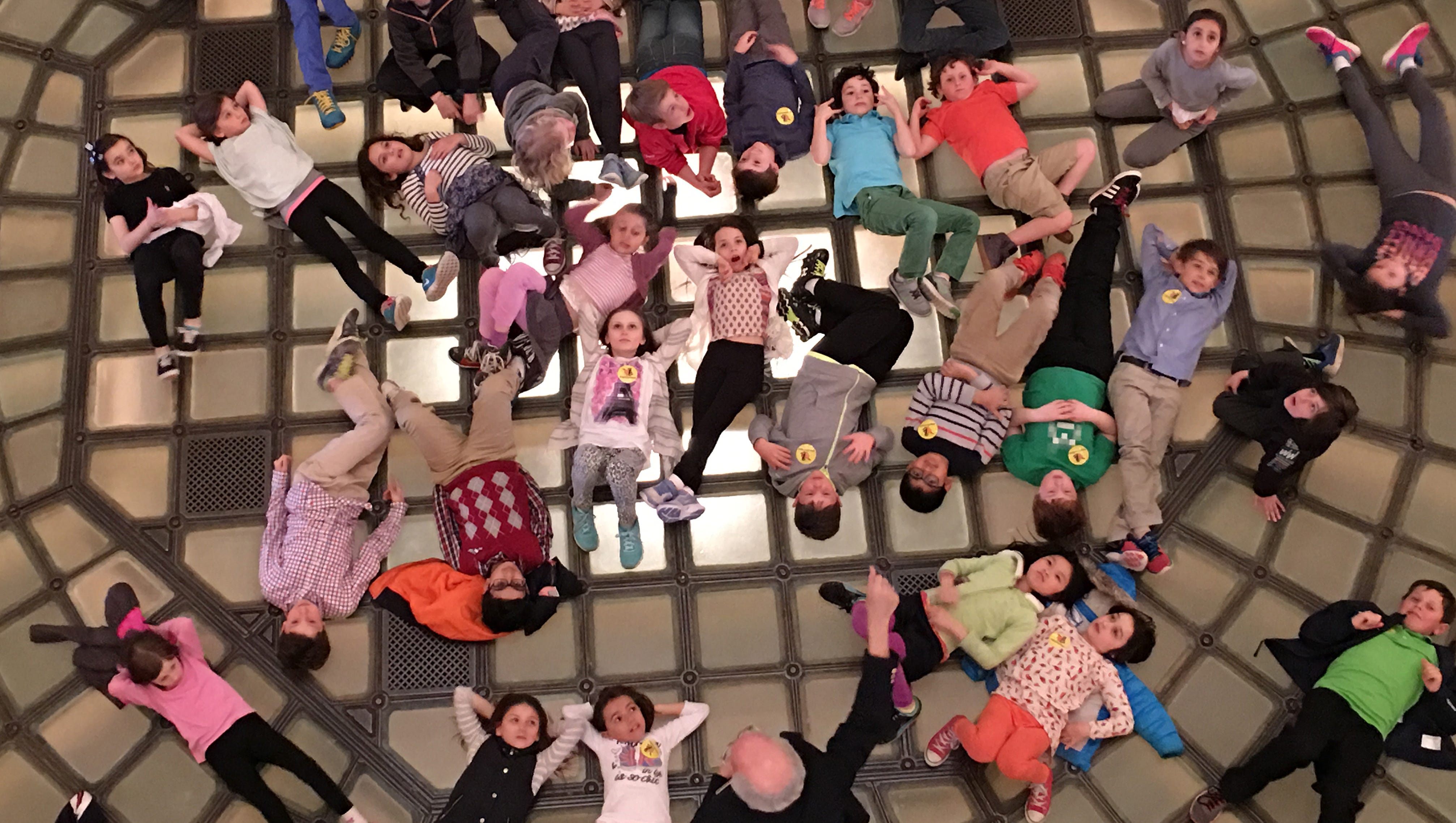 Third graders from Cranbrook Schools in Bloomfield Hills lie on the floor of the state Capitol and look up at the dome in "Capitol Tour from the Capitol Floor," by Keith Lublin of West Bloomfield. "Although we chaperones were supposed to stay together with the kids," Lublin said, "I couldn't resist slipping away to the second floor to capture this picture."