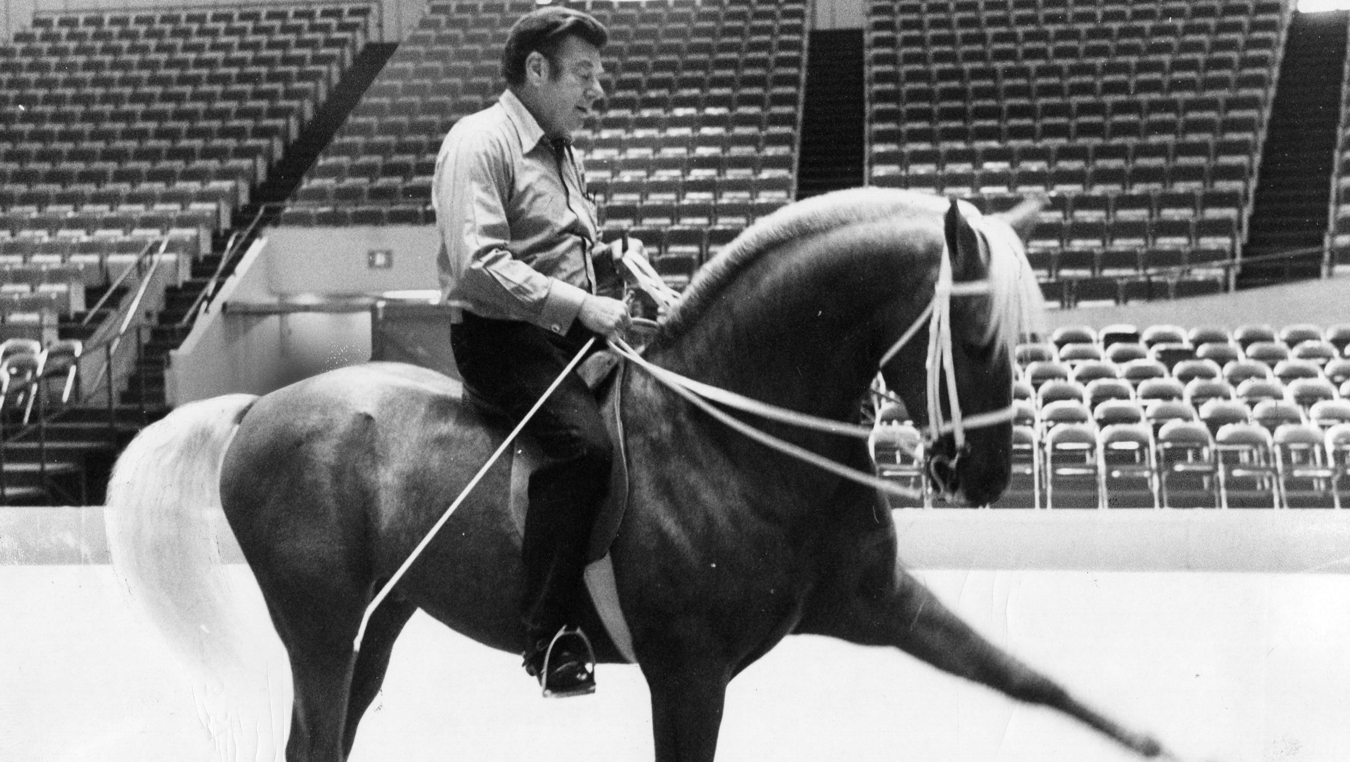 Entertainer Arthur Godfrey rides Goldie the horse at Cobo Arena on Dec. 1, 1972.