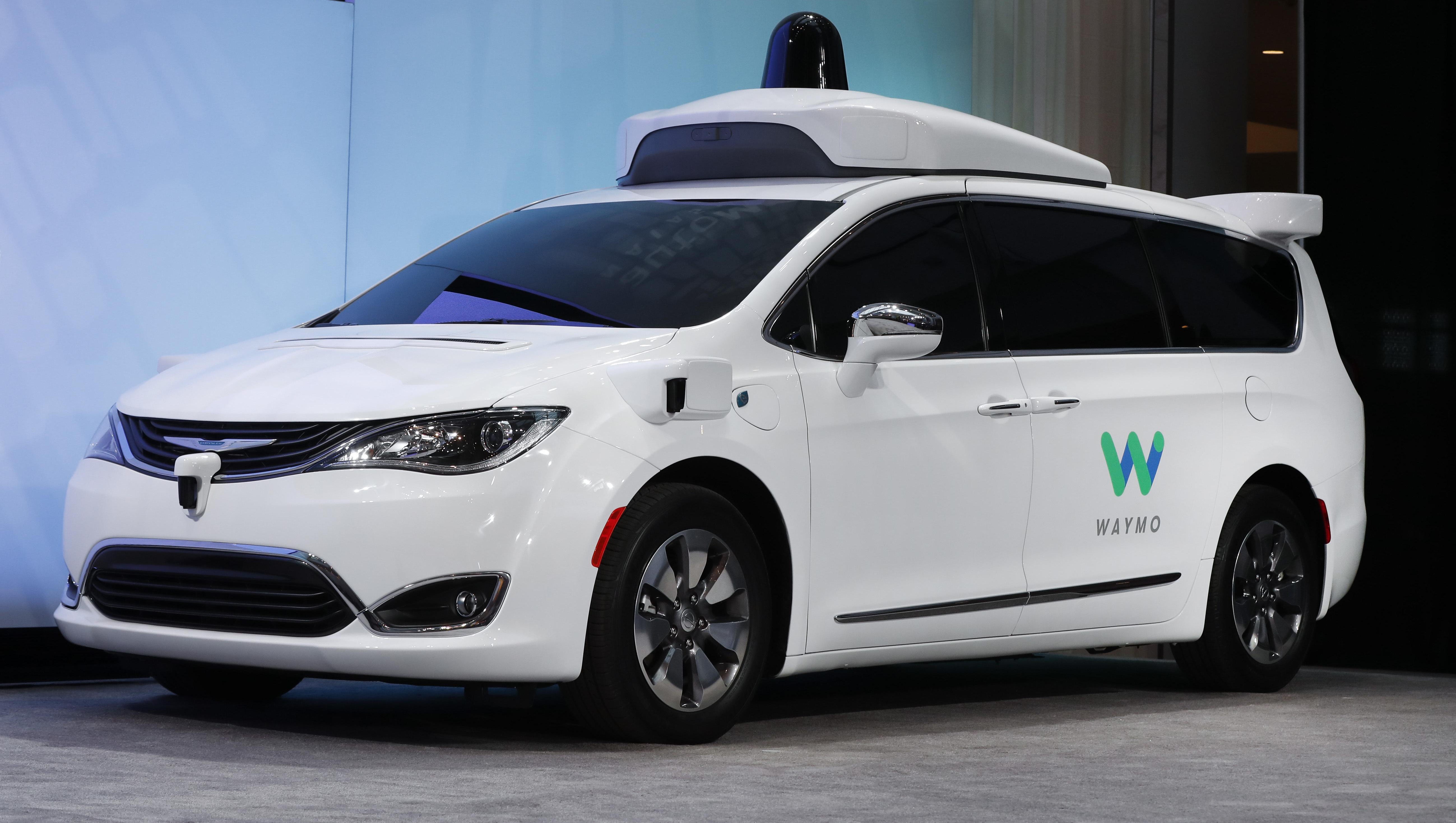 A Chrysler Pacifica is outfitted with Waymo LLC's self-driving system. The Google spinoff says it will invest up to $13.6 million in a new facility in Metro Detroit to integrate its technology into automaker partners' vehicles.
