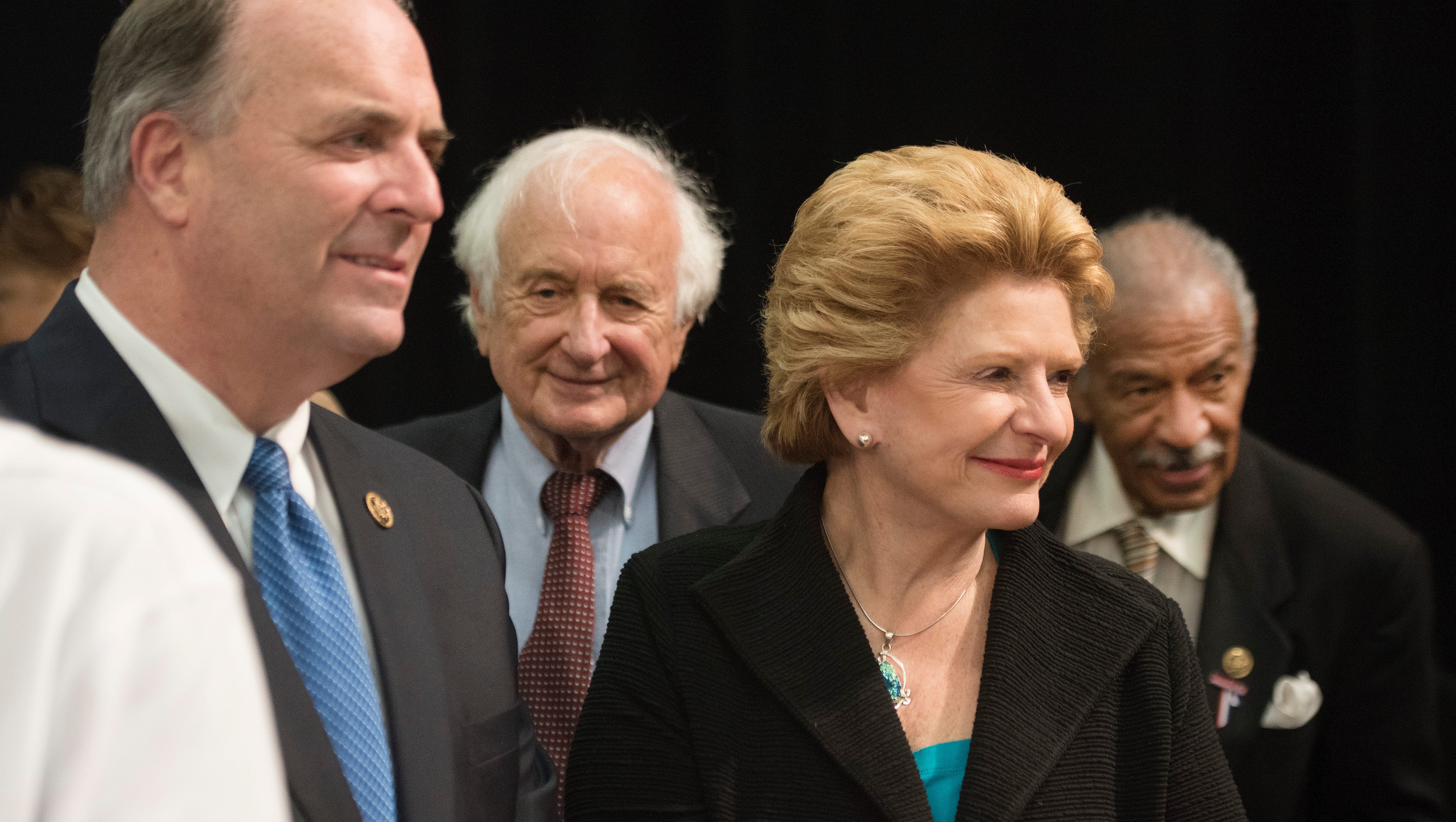 Michigan politicians Rep. Dan Kildee, from far left, Rep. Sander Levin, Sen. Debbie Stabenow and Rep. John Conyers attend the speech  by President Barack Obama at Northwestern High School in Flint.