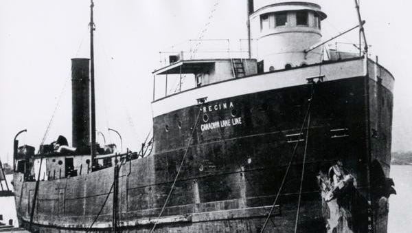 The SS Regina was anchored east of Lexington, Michigan in Lake Huron. Top-heavy with a load of sewer pipes, it capsized under heavy waves and sank.  Twelve bodies and a capsized lifeboat from the ship were found 30 miles east near Port Franks, Ontario. There were no survivors. The wreck of the Regina was discovered in 1986, upside down in about 80 feet of water.