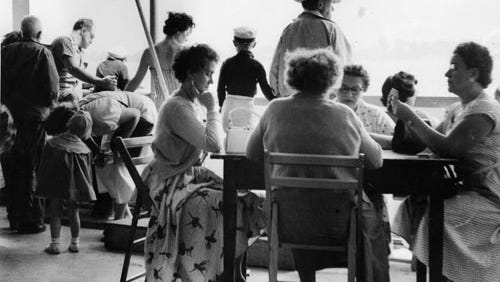 Women play cards en route to Boblo Island on July 15, 1954. The breeze on the river provided a welcome relief from the summer heat in the days before air conditioning.