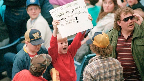 A young Jake "The Snake" Roberts fan gets his message across with a sign.
