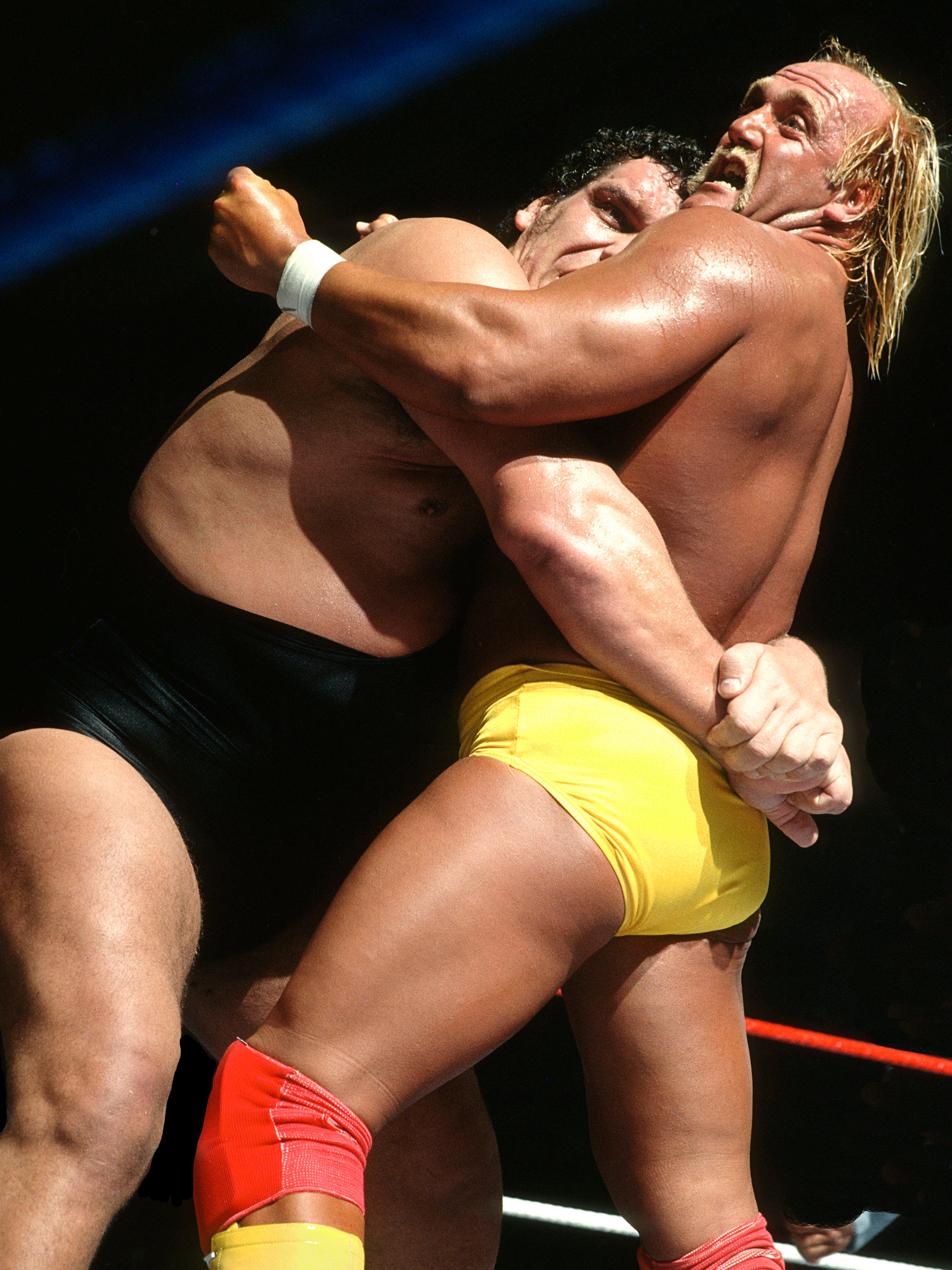 Andre the Giant puts Hulk Hogan in a bearhug late in their main-event spectacle.