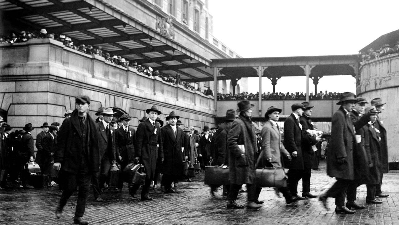 Men head off to World War I as family members watch.