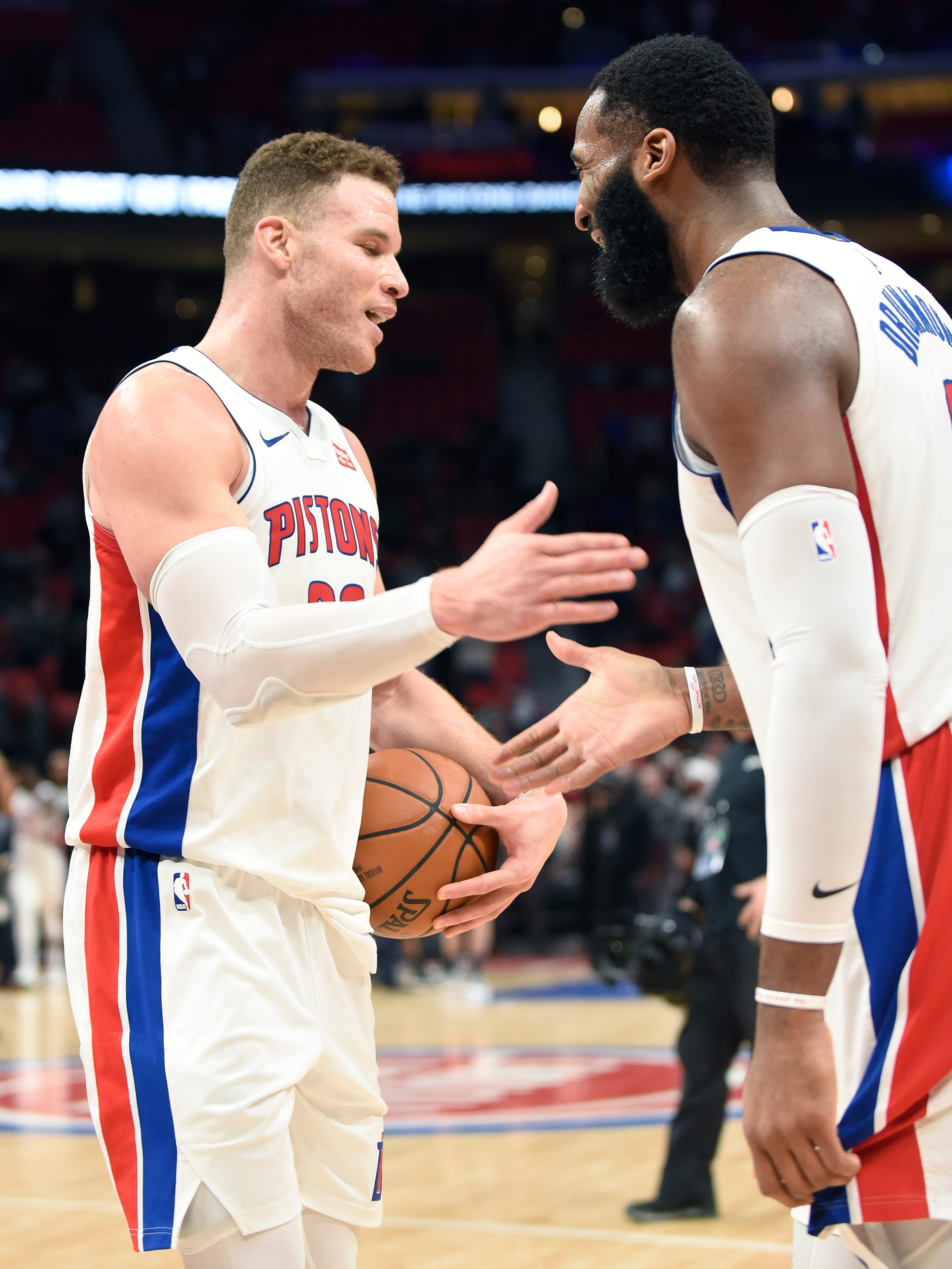 Pistons' Blake Griffin, left; and Andre Drummond celebrate at the end of the game.