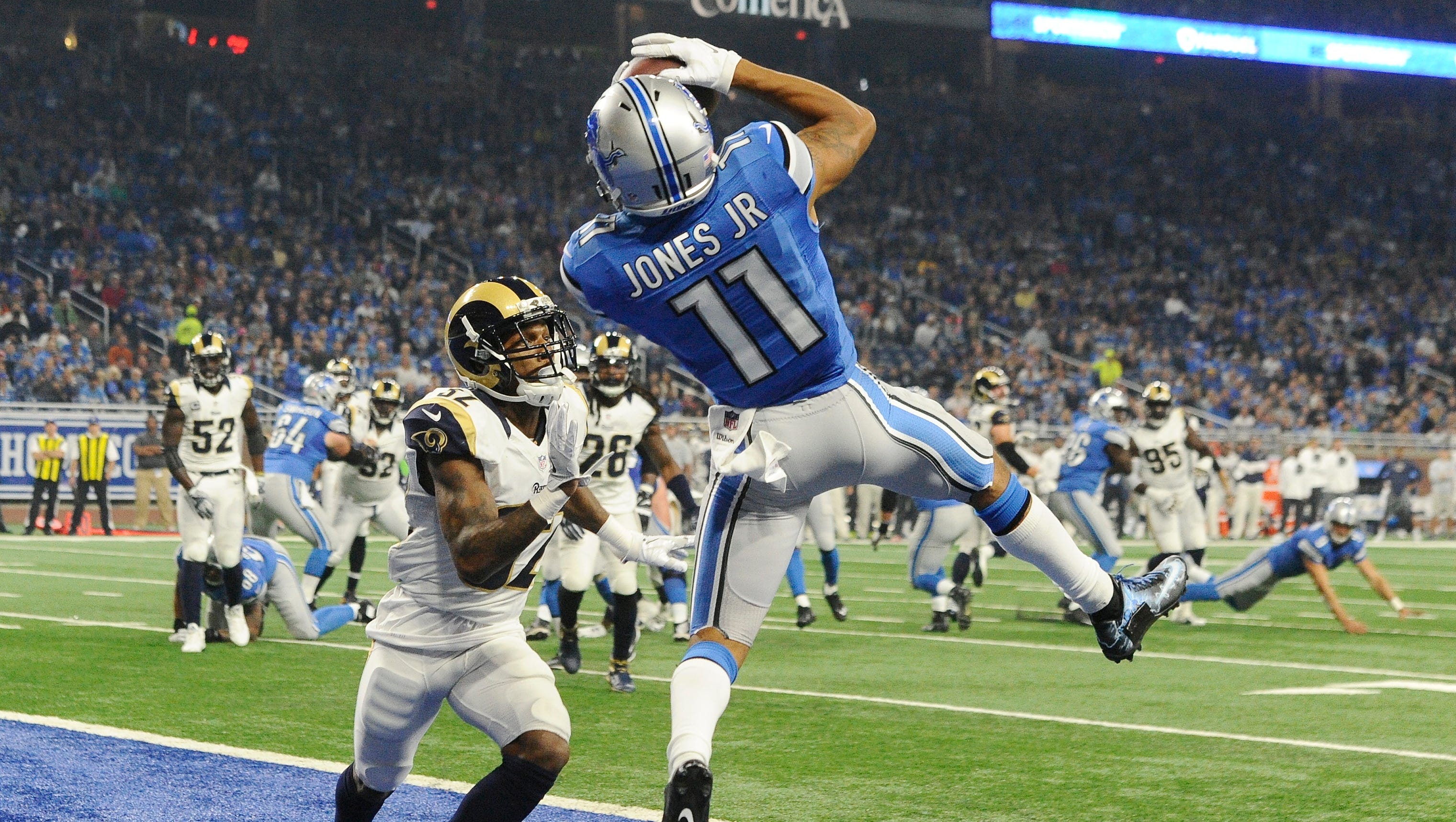 Lions wide receiver Marvin Jones Jr. pulls down a leaping touchdown over the Rams' Troy Hill on Detroit's first offensive drive in the first quarter.