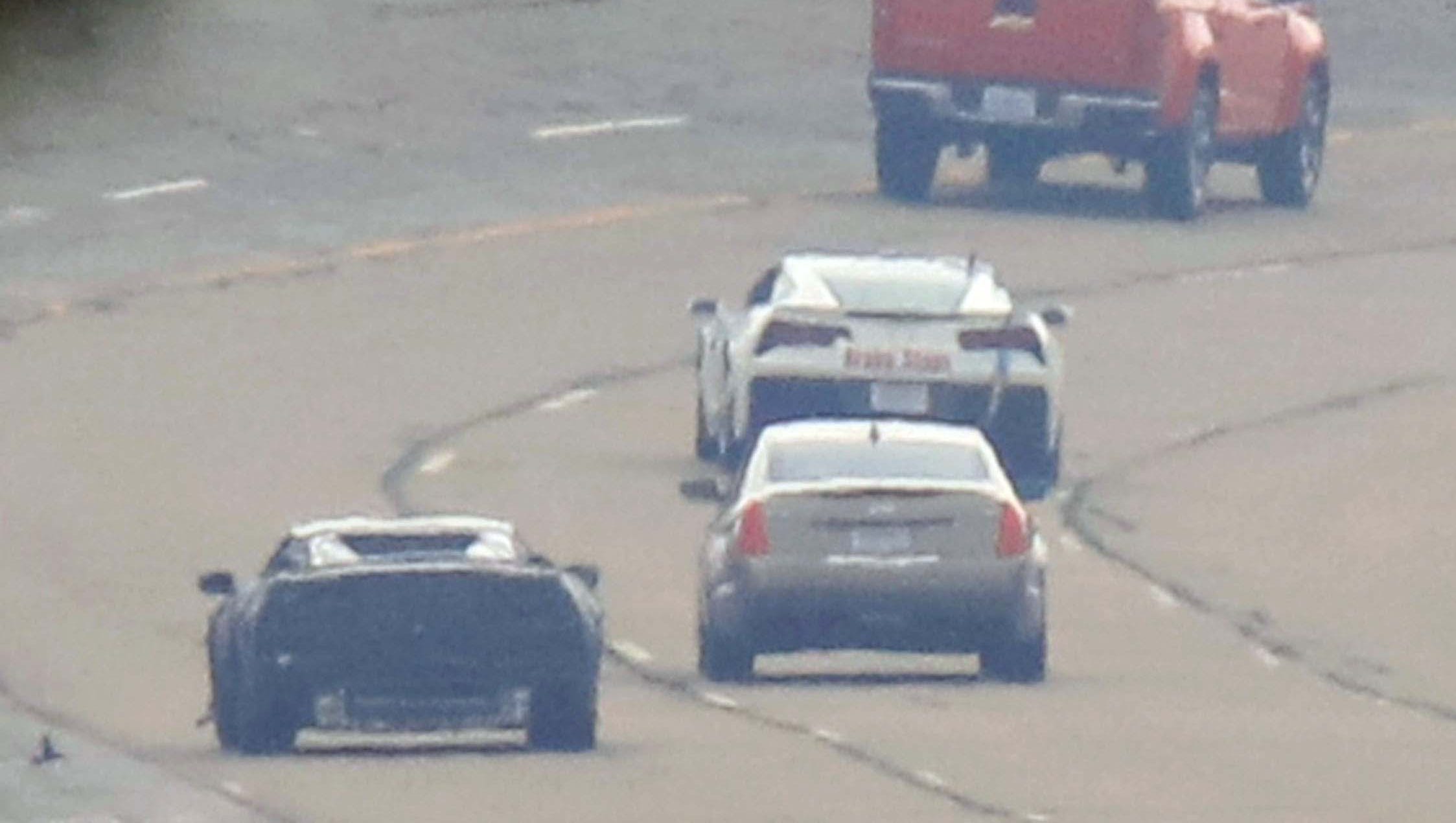 In this spy shot taken in June, 2016 at GM ' s Milford Proving Grounds, the small, mid-engined Corvette C8 test " mule " (left) runs with bigger siblings like the (from top to bottom) Chevy pickup, Cadillac sedan, current Corvette C7, and Chevy pickup truck.