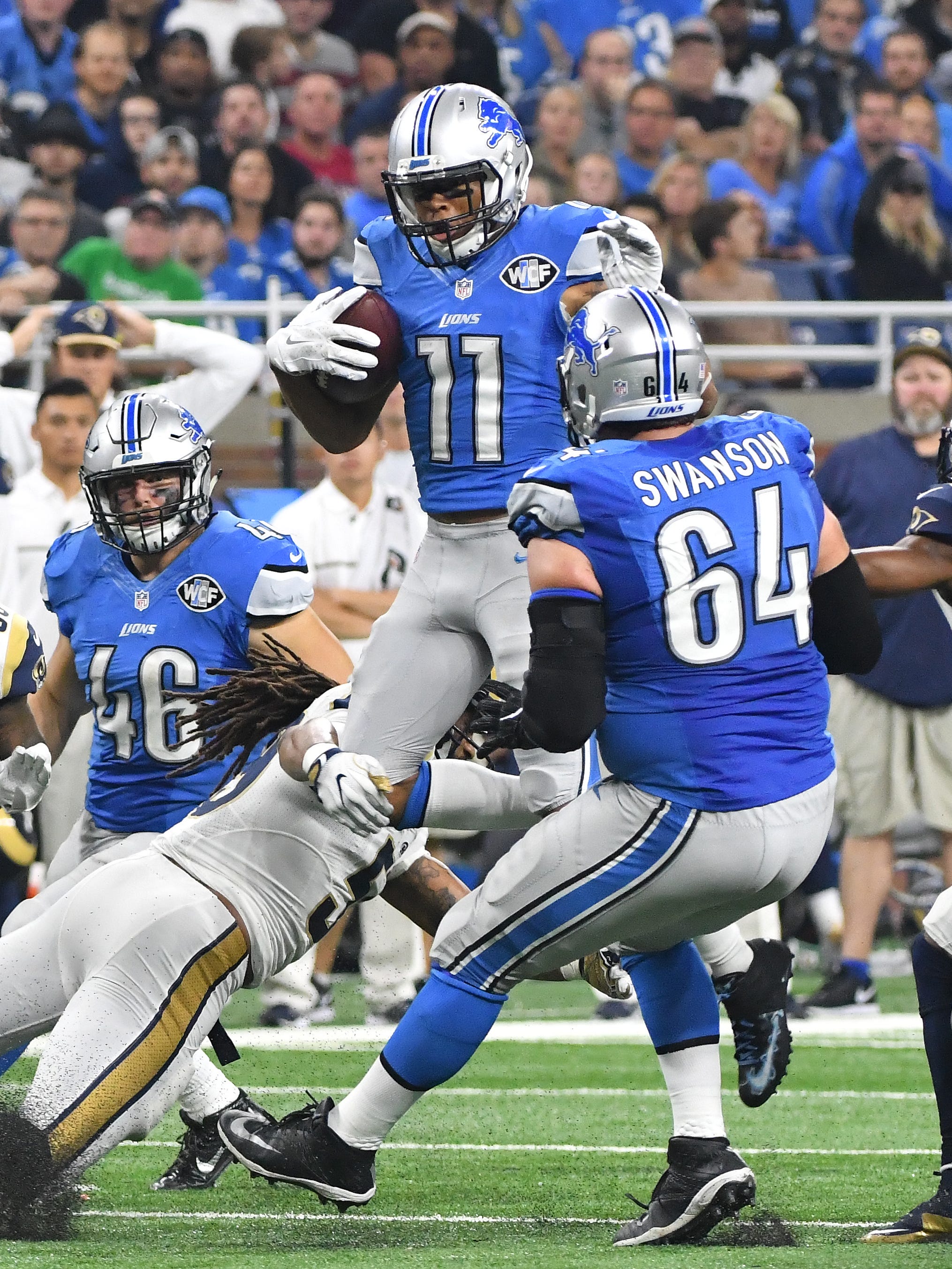 Lions wide receiver Marvin Jones Jr. leaps up trying to gain yardage after a reception in the fourth quarter.