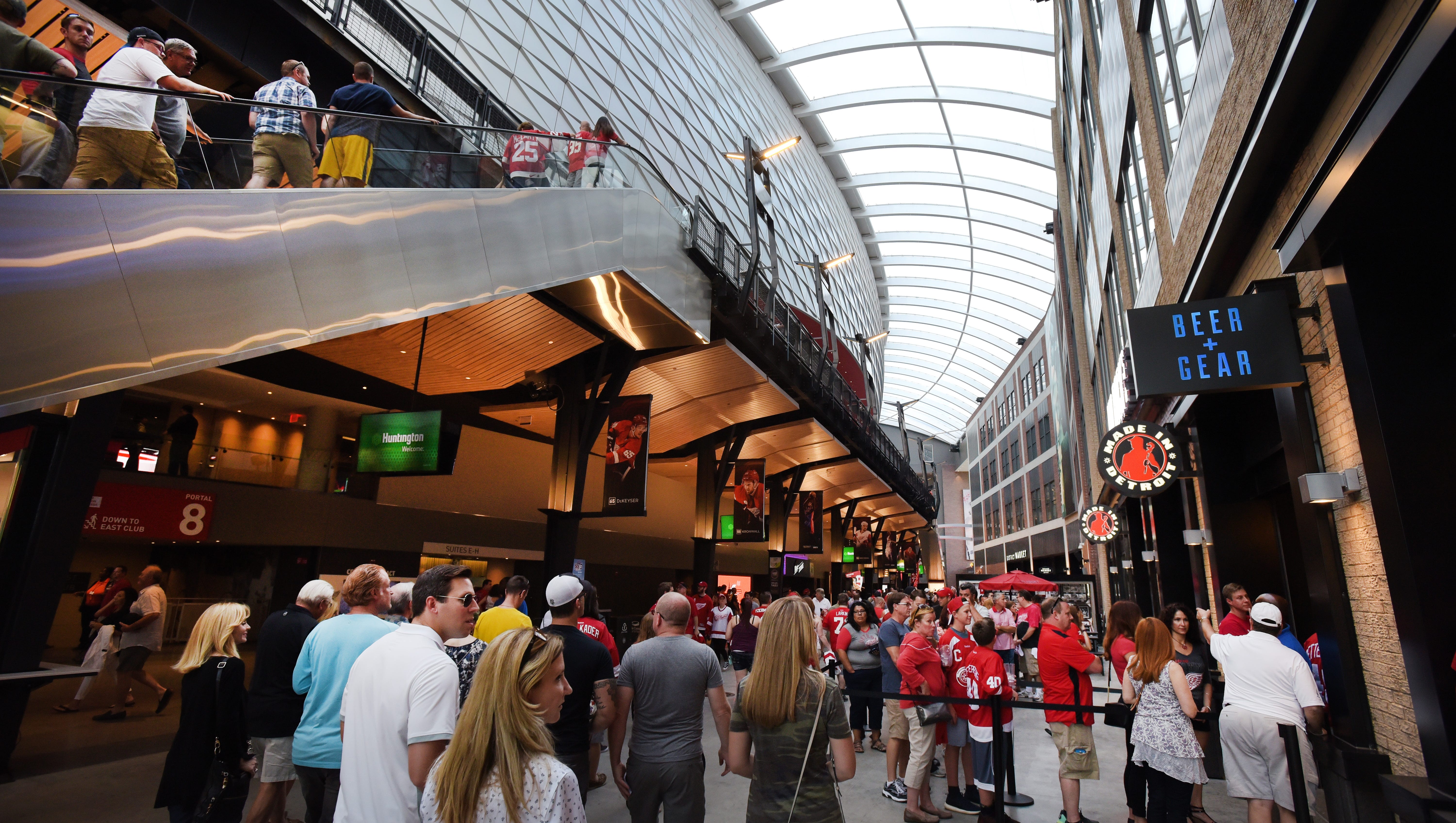 Fans make their way down the main concourse and into restaurants at Little Caesars Arena.