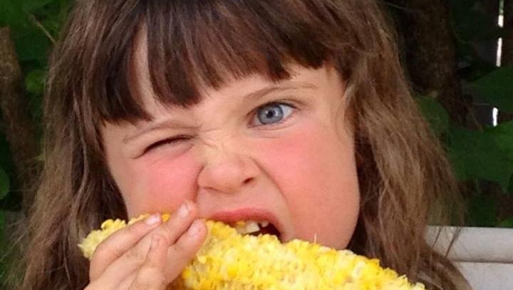 "Myla had a loose tooth, but she was still determined to eat her corn on the cob that we picked up from Ginn's Farms at the Clarkston Farmers' Market!" said MylaÕs mom, Kelly Minnick of Waterford. She titles her photo "Determination."