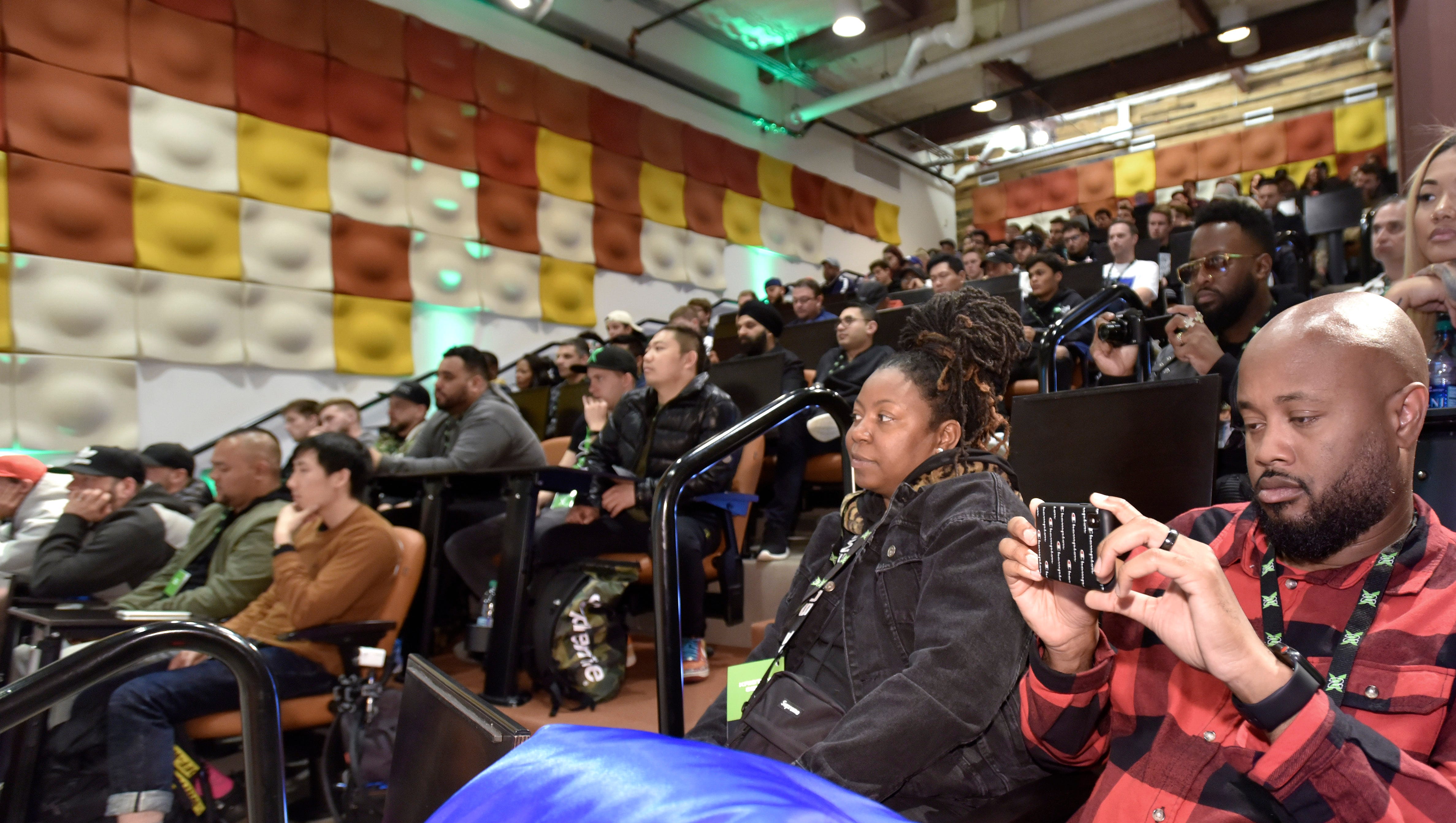 Ohmare Washington, right, 37, of Houston, records the Stock X event in Detroit.

XXXXBuyers, sellers and fans of StockX listen to company CEO and co-founder Josh Luber during the StockX Day2 event in the Madison building, Friday afternoon, April 20, 2018. StockX is a secondary market for the resale of sneakers, street wear, hand bags and watches. (Todd McInturf, The Detroit News)2018.