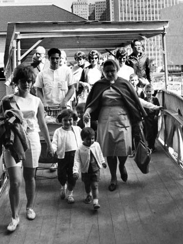 Boblo-bound passengers board a boat in Detroit on May 28, 1966.