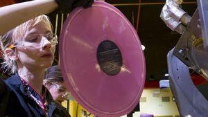 ress operator Alejandra Villegas removes a freshly pressed album from a book mold while testing the new vinyl pressing system at Third Man Pressing, Feb. 16 2017.