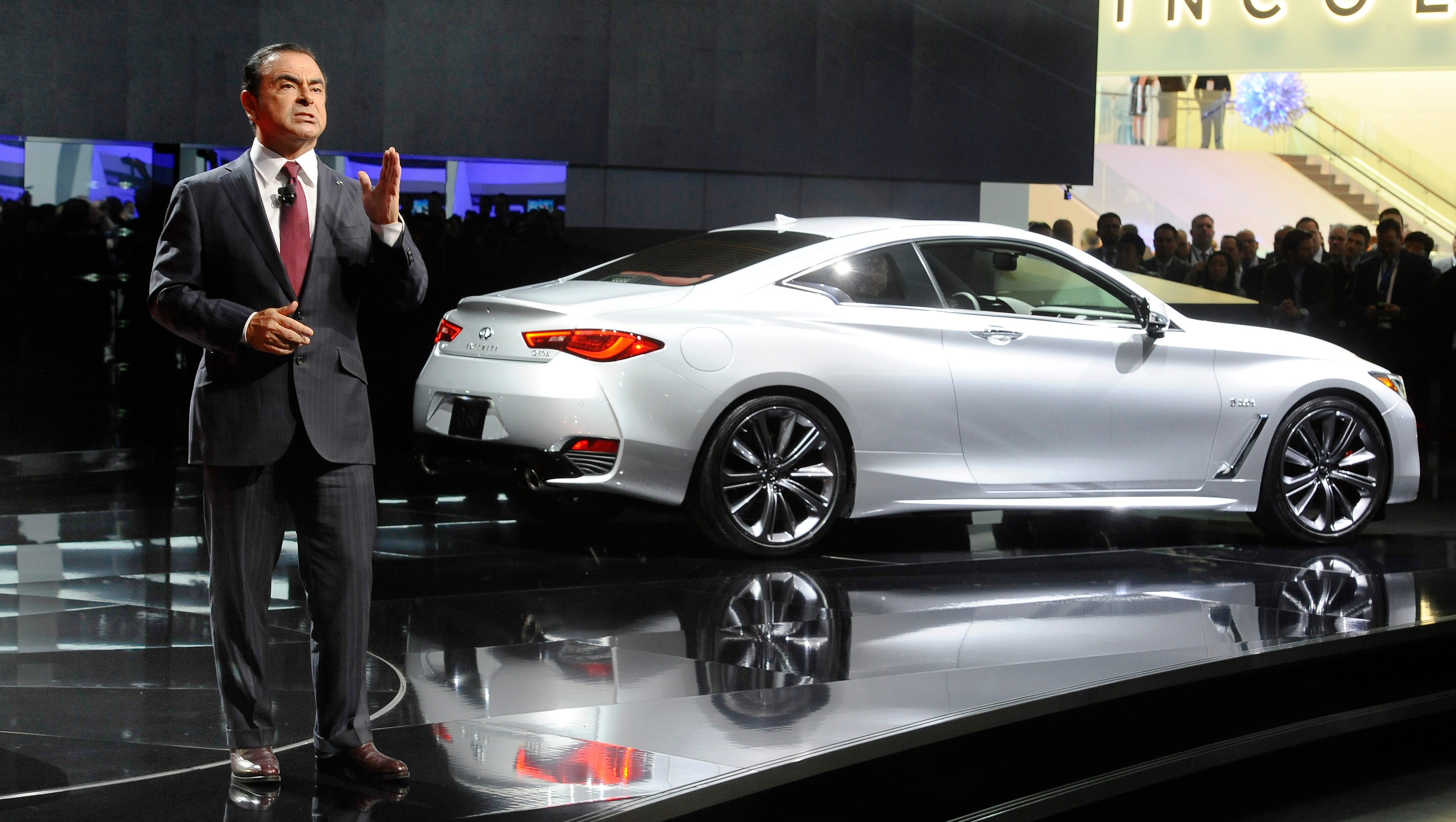 Nissan Motor’s chairman Carlos Ghosn, seen here introducing the Infiniti Q60, has been arrested and will be dismissed for alleged under-reporting of his income and misuse of company funds, the company said Monday.