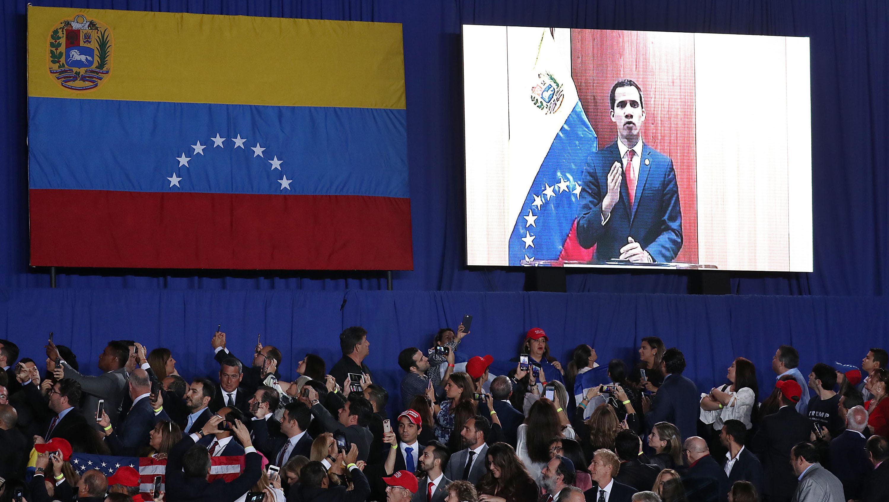 Venezuelan opposition leader Juan Guaido speaks via a telecast to a crowd at Florida International University. South Florida is home to more than 100,000 Venezuelans and Venezuelan-Americans.