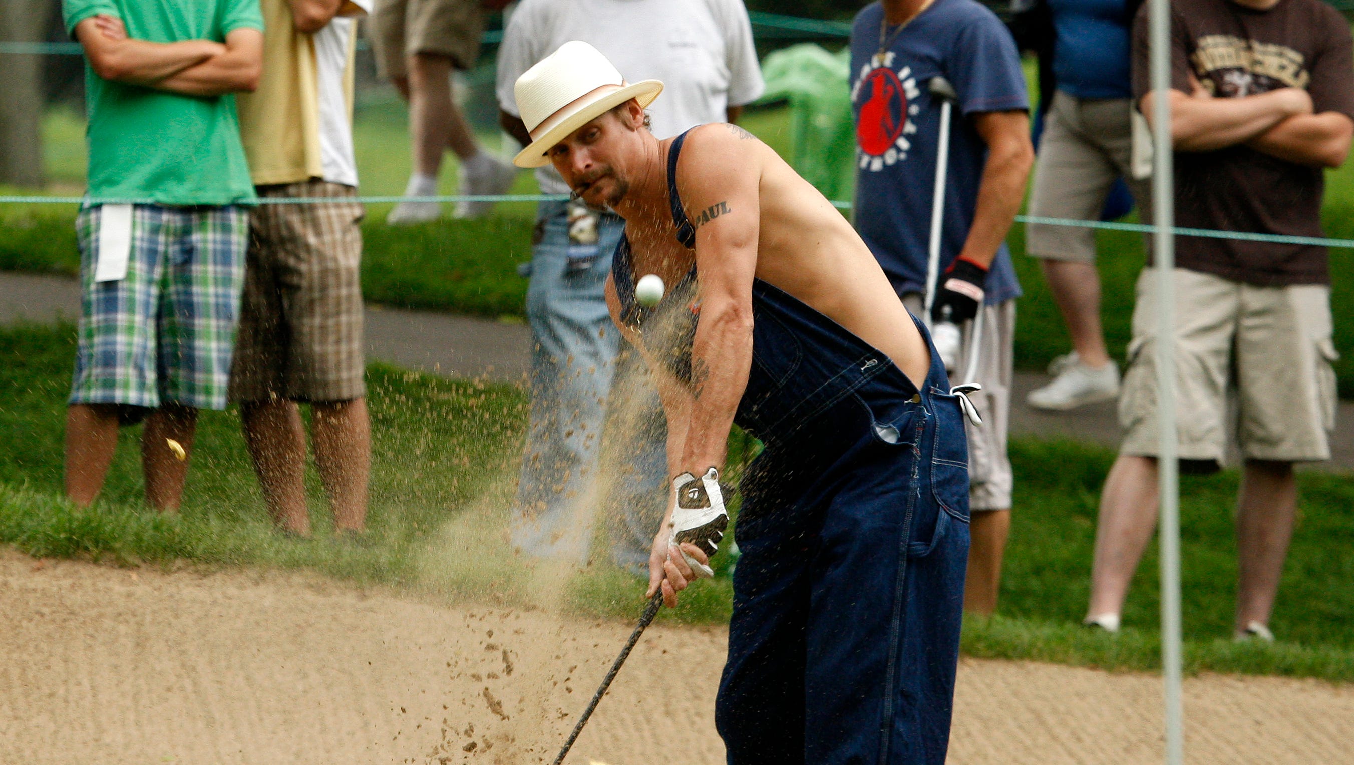 Kid Rock hits out of a sand trap on the 16th hole during the 2008 Buick Open pro-am.