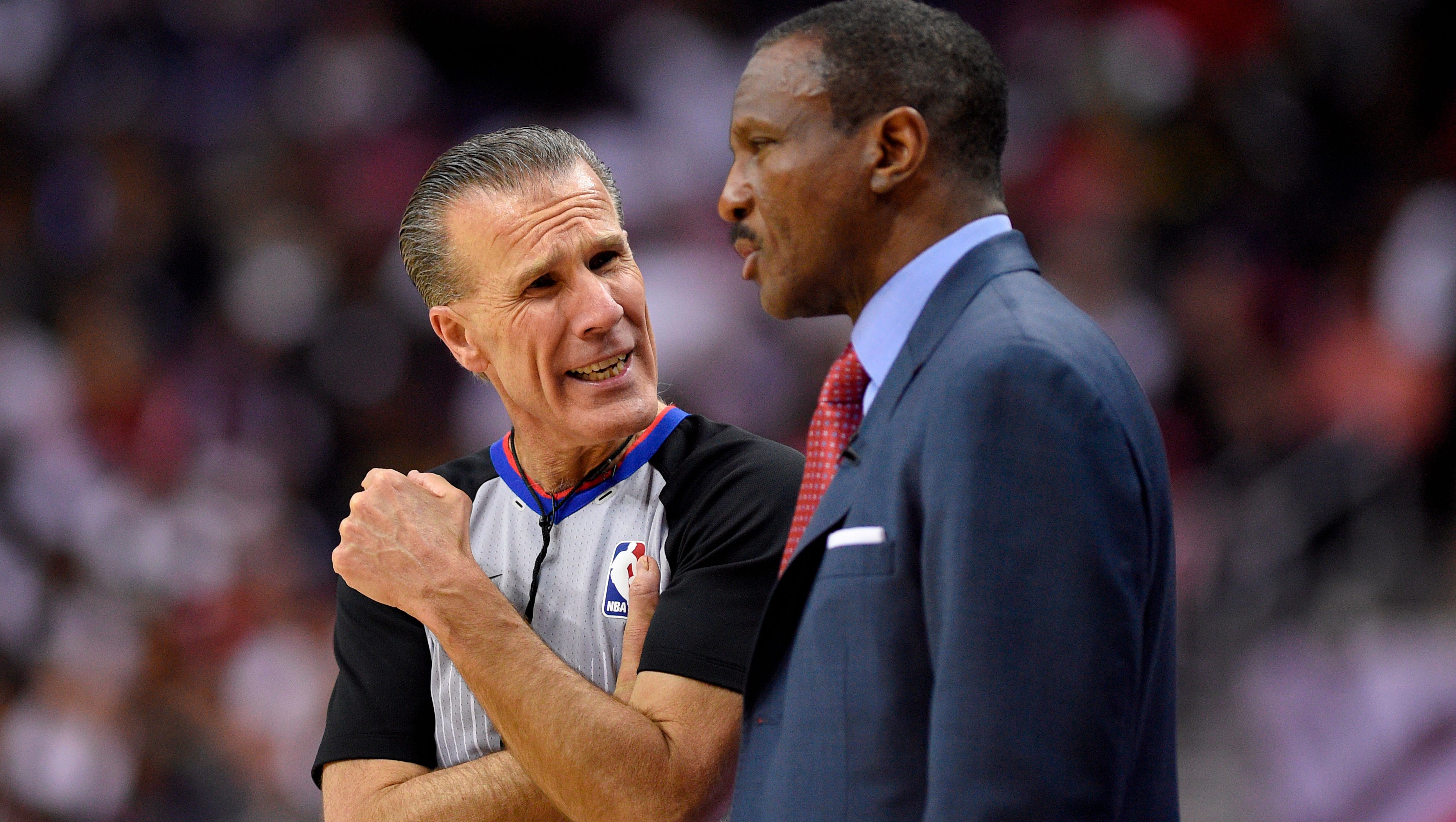 Referee Ken Mauer, left, talks with Toronto Raptors head coach Dwane Casey, right, during the second half of Game 3 of an NBA basketball first-round playoff series, Friday, April 20, 2018, in Washington. The Wizards won 122-103.
