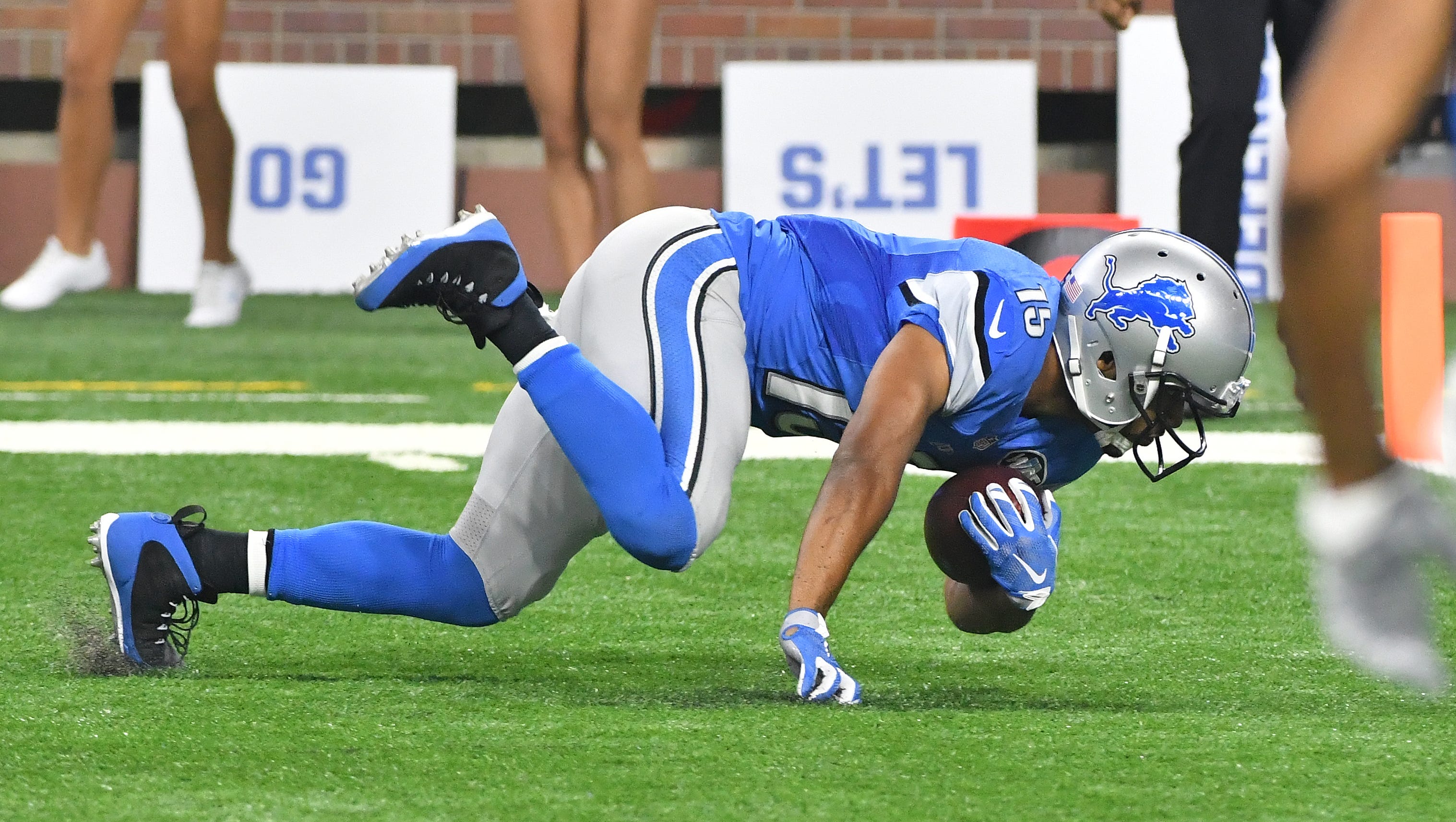 Lions wide receiver Golden Tate continues to crawl towards the goal line into the end zone but after an officials review, Tate was ruled down just short of the goal line.