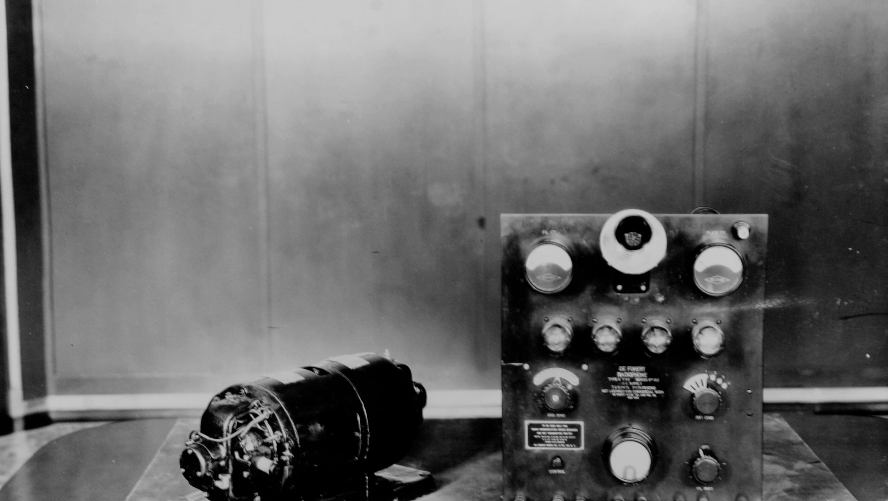 This is the first-generation equipment that powered the first transmissions of 8MK, which began broadcasting daily on an experimental basis, becoming the world's first commercial radio broadcasting station.   A quarter-horsepower motor drove the 150-watt/500 volt direct current generator that powered the transmitter, right, consisting of two oscillator and two rectifier tubes.