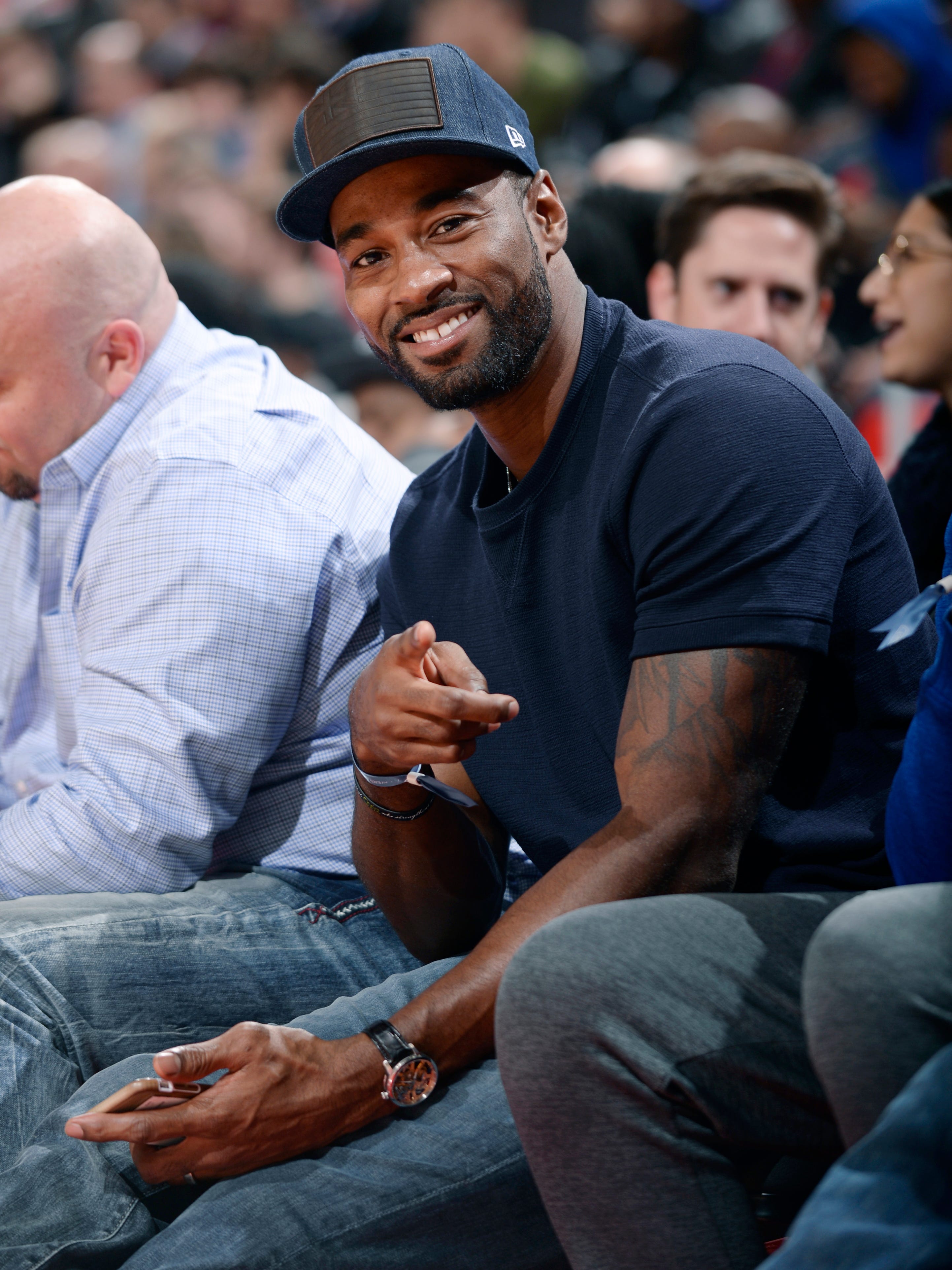 Former Lion Calvin Johnson, here at a Pistons-Cavaliers game at Little Caesars Arena, is trying to get prequalification approvals for a medical marijuana provisioning center.