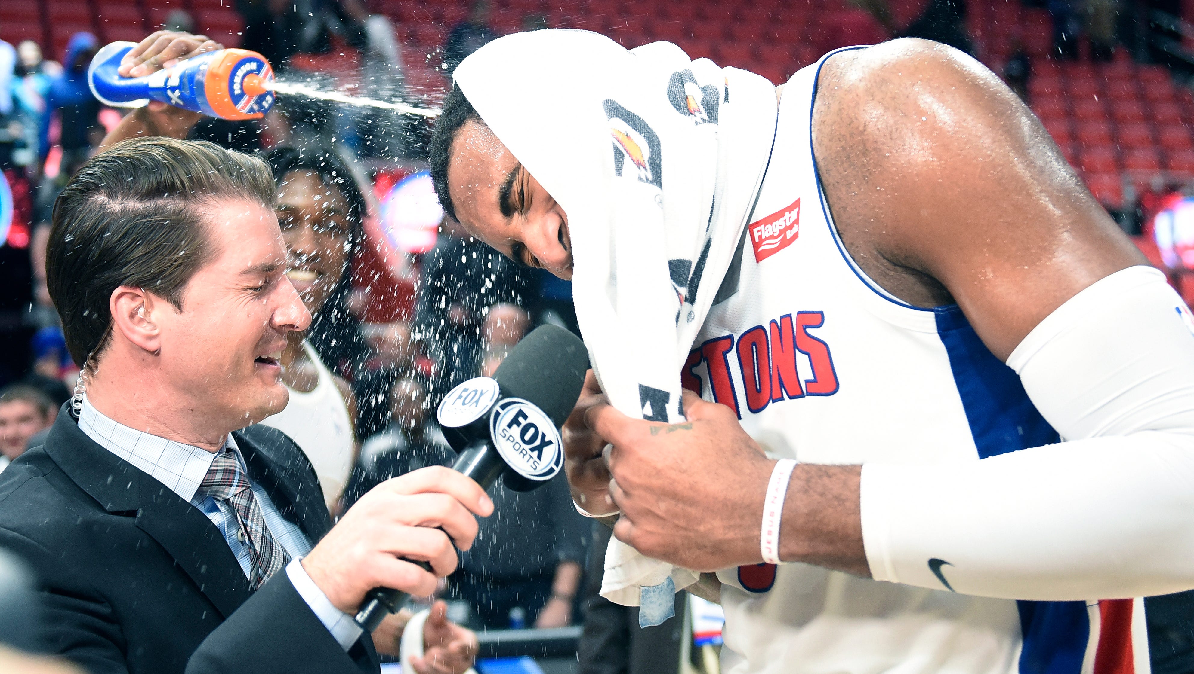 Pistons' Stanley Johnson sprays Andre Drummond with water during his postgame interview with Fox Sports Johnny Kane.