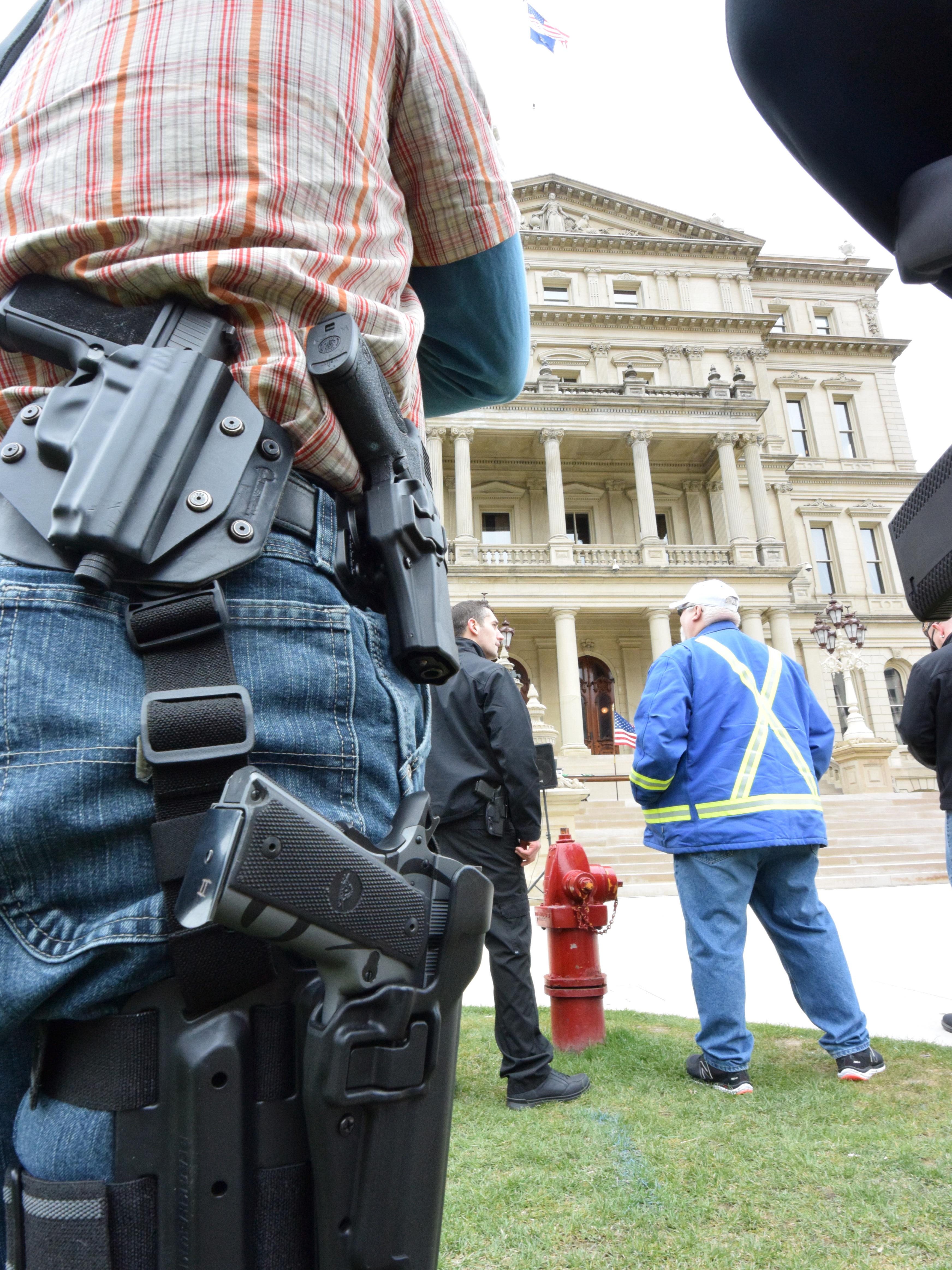 About 150 gun owners gathered on the lawn of the state Capitol on Wednesday for the annual Second Amendment March, celebrating their legal right to carry guns in the open in Michigan.