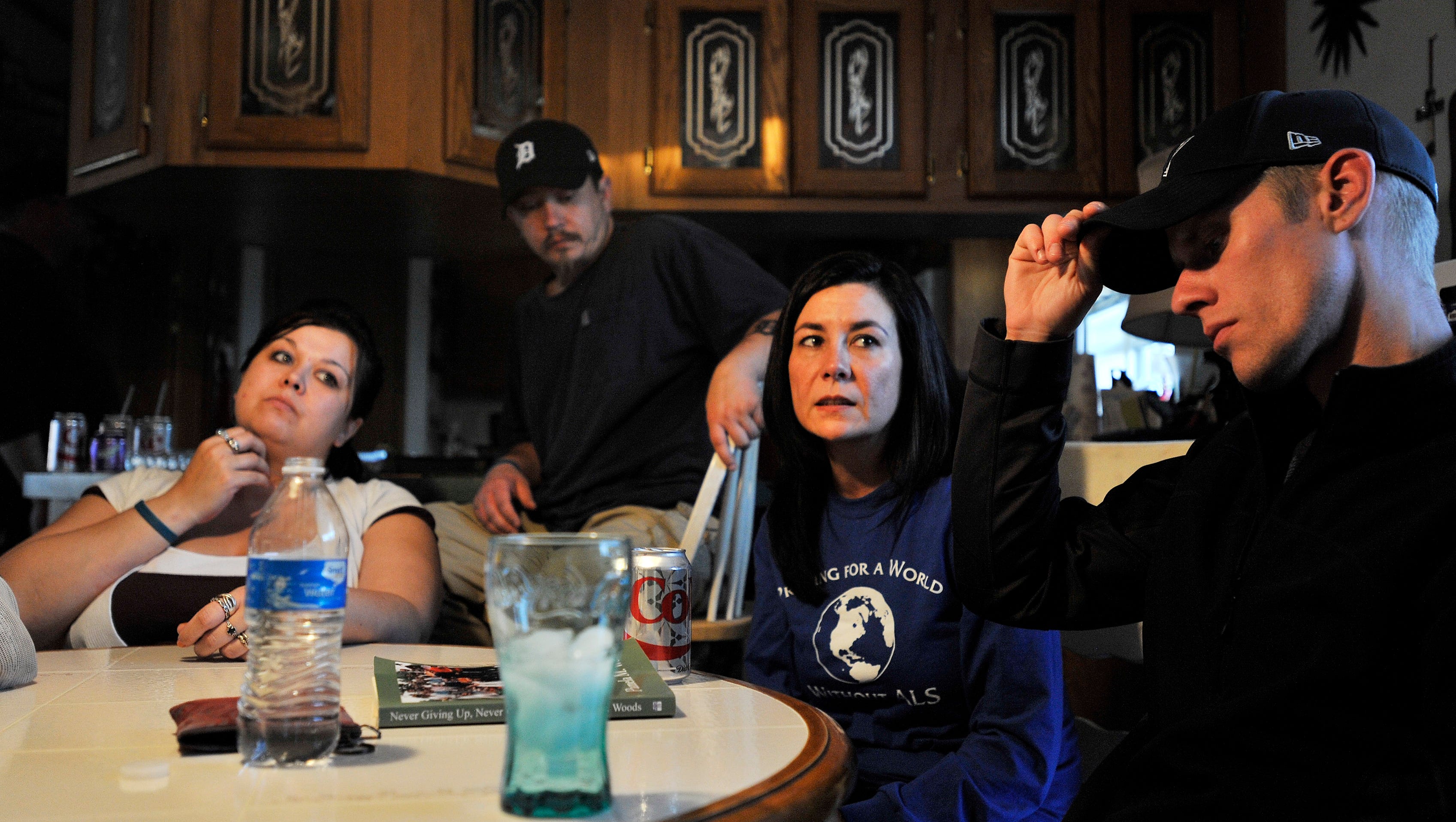 April Colvin, second from right, has started fundraising for her brother, Lucas Gutherie, and talks about his diagnosis with Lucas' wife, Shawna Gutherie, left, and Ryan Thiel, right, after a Sunday family meal.