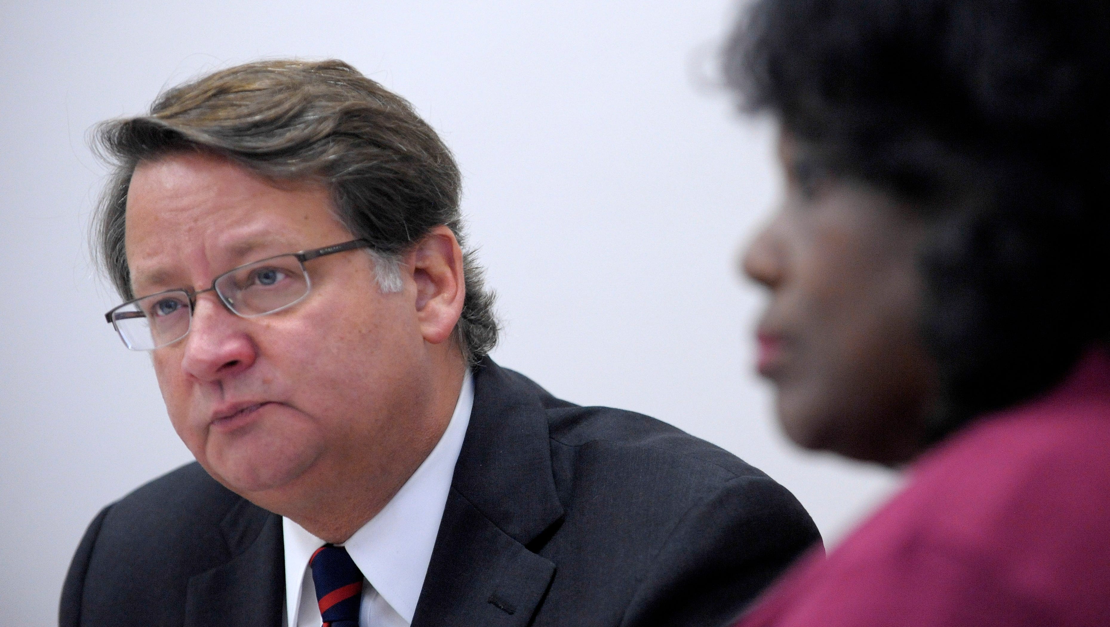 U.S. Congressman Gary Peters, left, talks with Fredricka Collier, 65, of Port Huron, and other foster grandmothers.