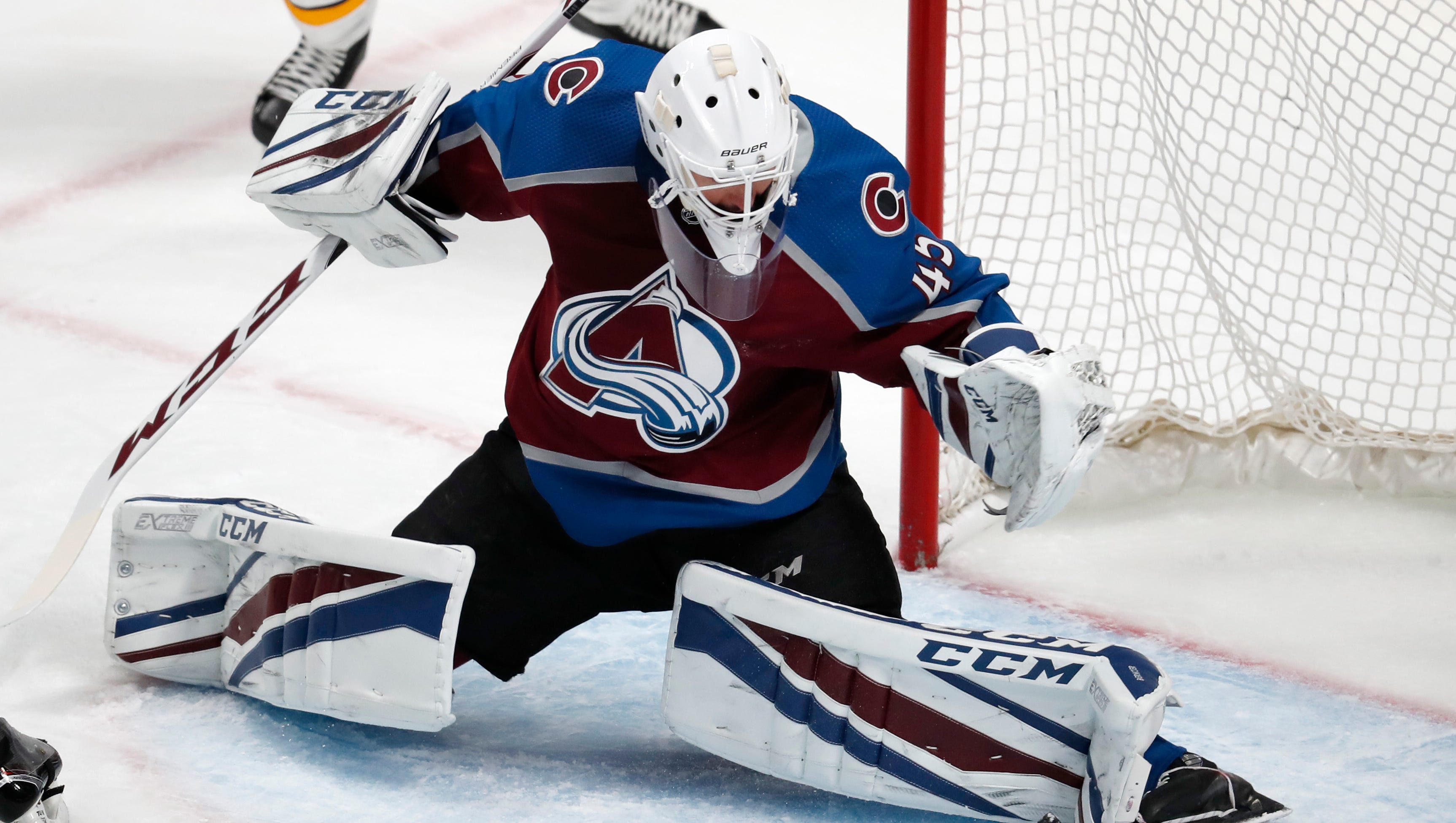 Colorado Avalanche goaltender Jonathan Bernier makes a pad save of a shot by the Nashville Predators during the first period of Game 4 of a first-round playoff series Wednesday, April 18, 2018, in Denver.