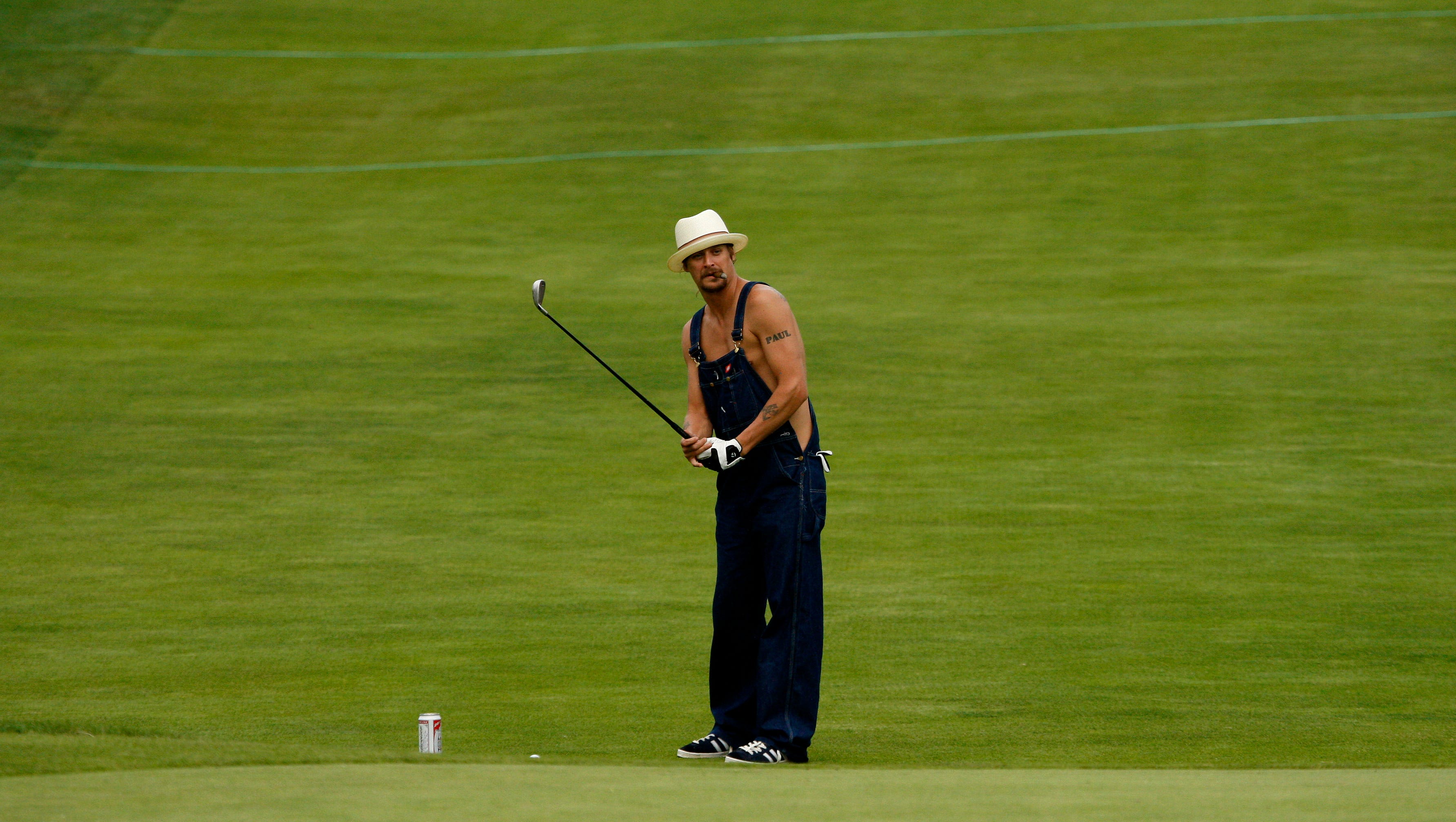 Kid Rock looks to approach the 18th green at the Buick Open pro-am in 2008.