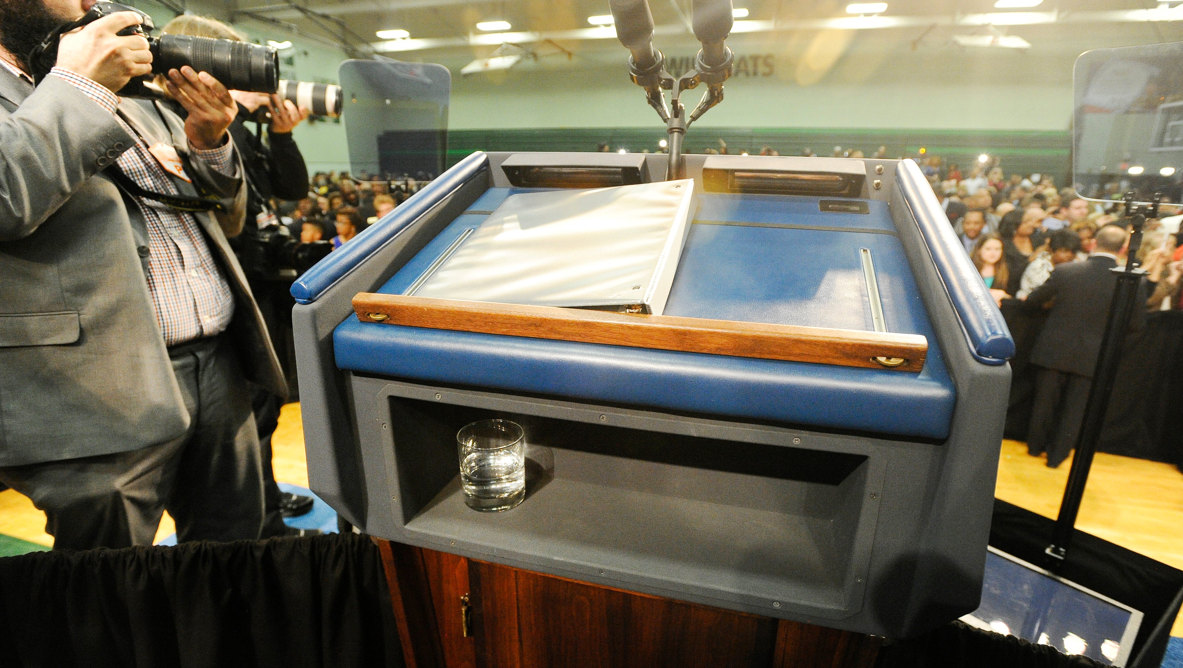 The half drunken glass of water at the podium after President Obama spoke at Northwestern High School in Flint.
