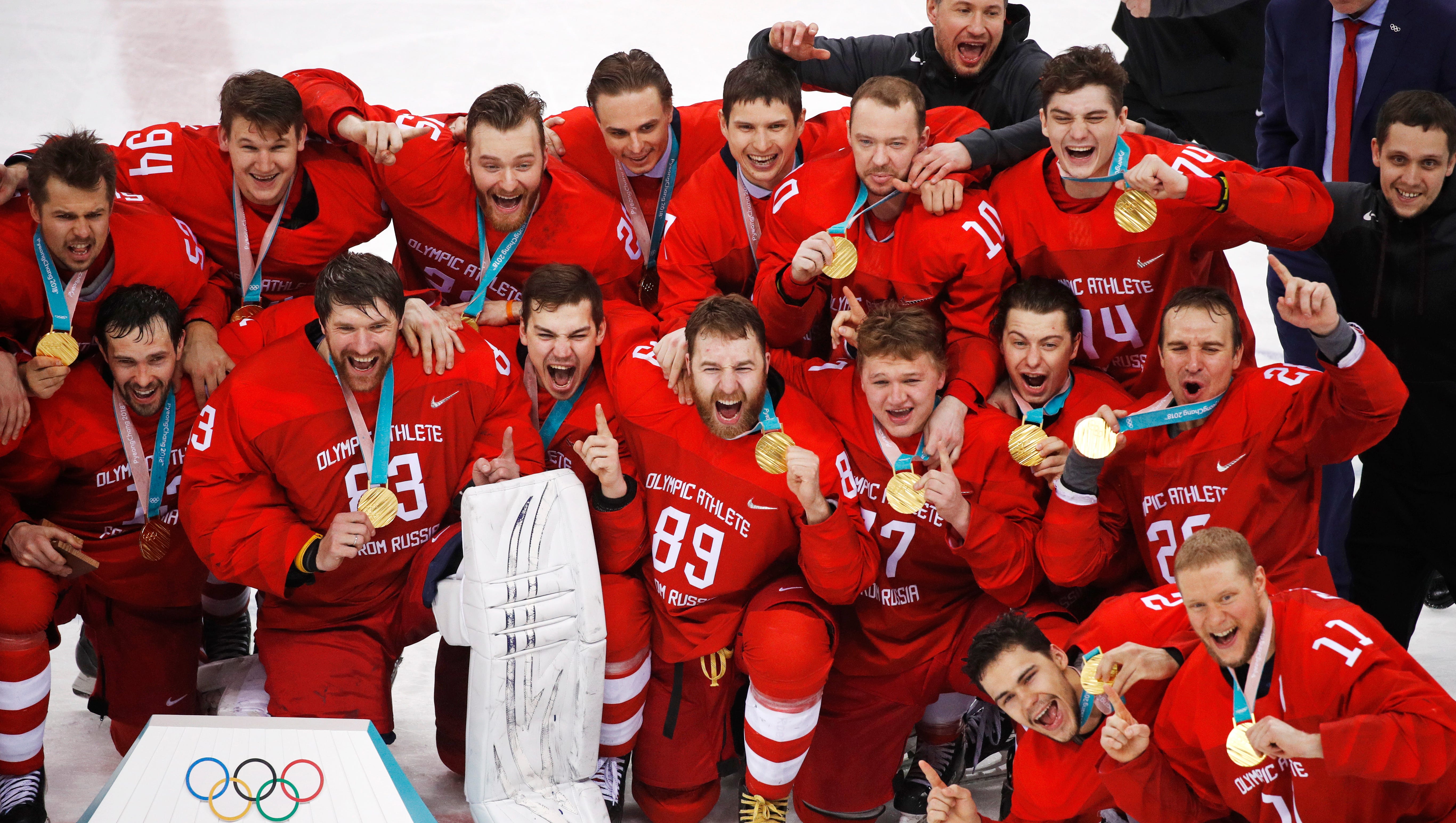 Olympic athletes from Russia celebrate after winning the men's gold medal hockey game against Germany.