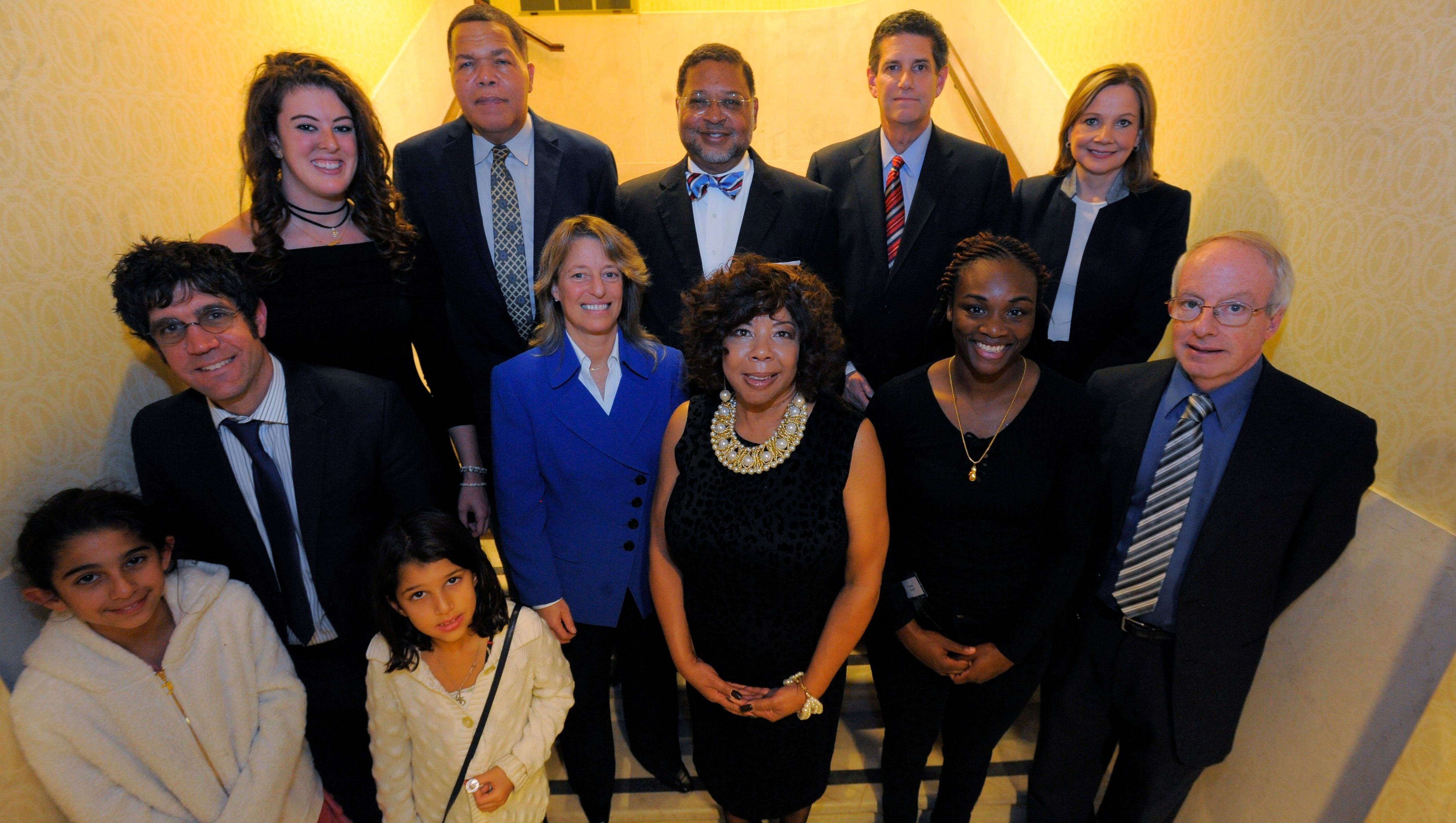 The 2016 Michiganians of the Year, honored at a Detroit News banquet on Nov. 30, 2016, are: Bottom row: Dr. Elliott Attisha representing Dr. Mona Hanna-Attisha with daughters Nina, 10, and Layla, 8, Linda Smith, Claressa Shields, David Moran. Second row: Allison Schmitt, Valerie Newman. Top row: Luther Keith, Chief Justice Robert P. Young Jr., Mark Davidoff and Mary T. Barra.