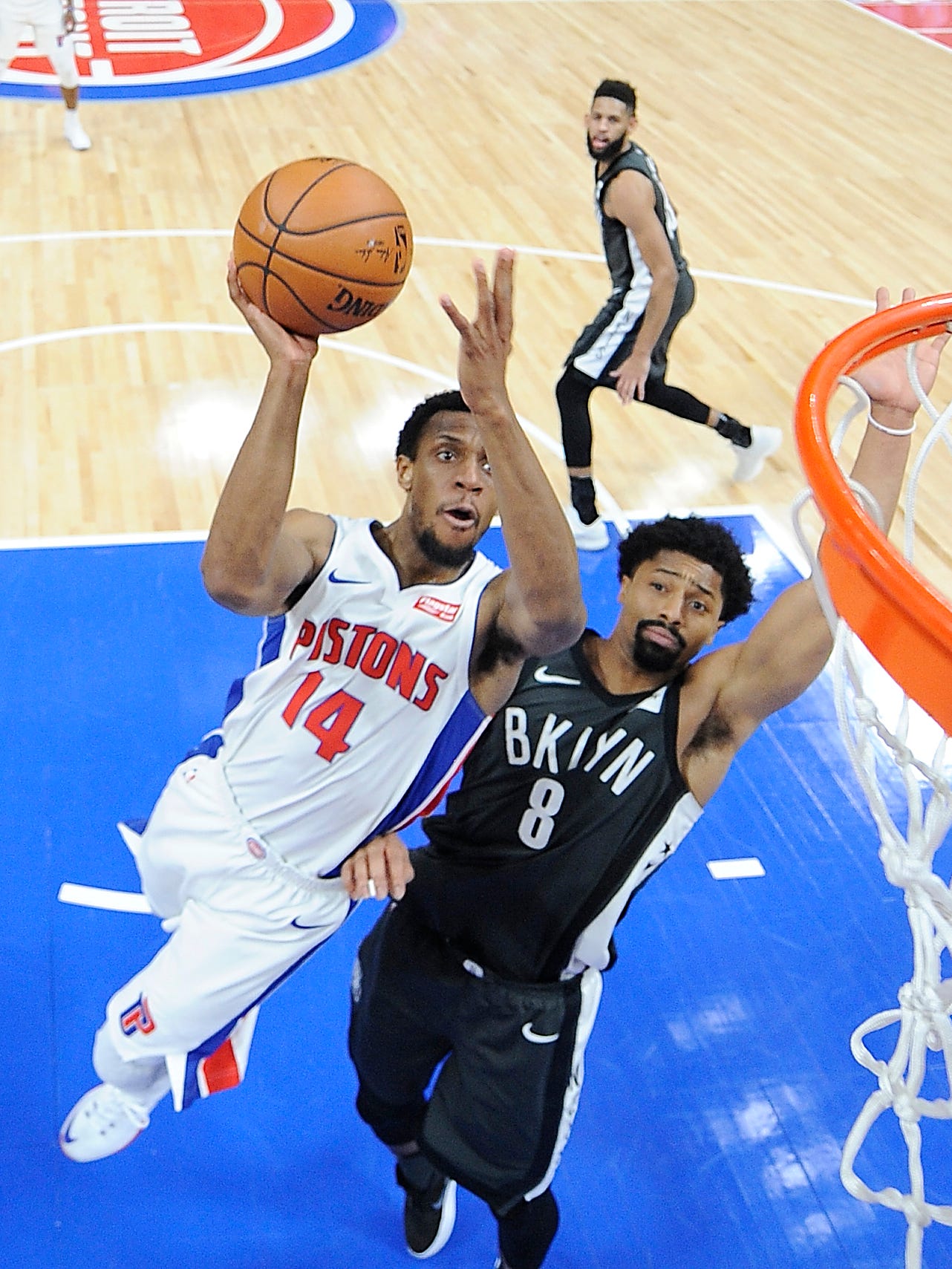 Pistons' Ish Smith shoots over Nets' Spencer Dinwiddie in the second quarter. The Pistons defeated the Nets 115-106, Wednesday, February 7, 2018 at Little Caesars Arena in Detroit, Michigan.