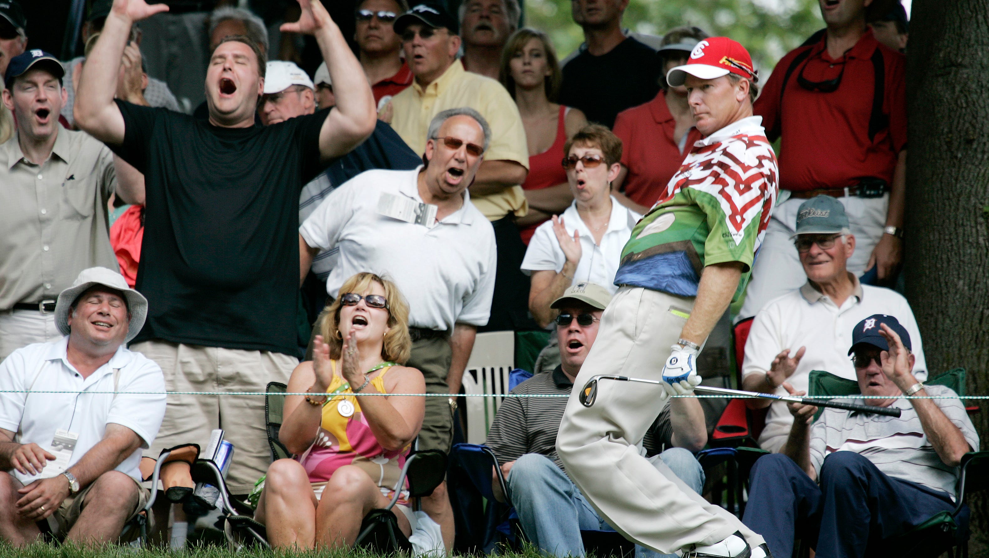 Woody Austin and the gallery react after Austin narrowly misses chipping in on the 16th green during the 2008 Buick Open.