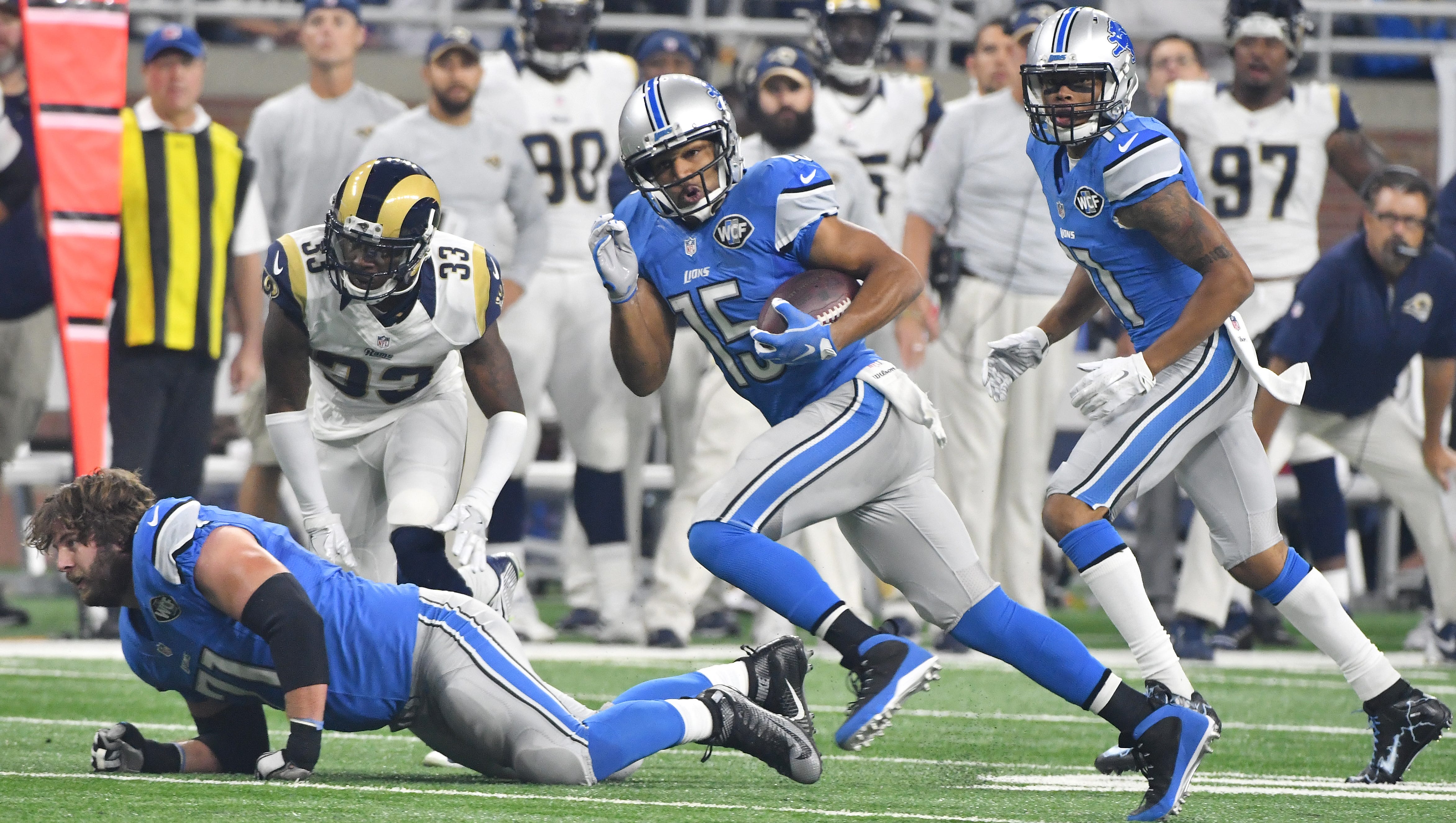 Lions wide receiver Golden Tate scrambles up field after a reception in the first quarter.