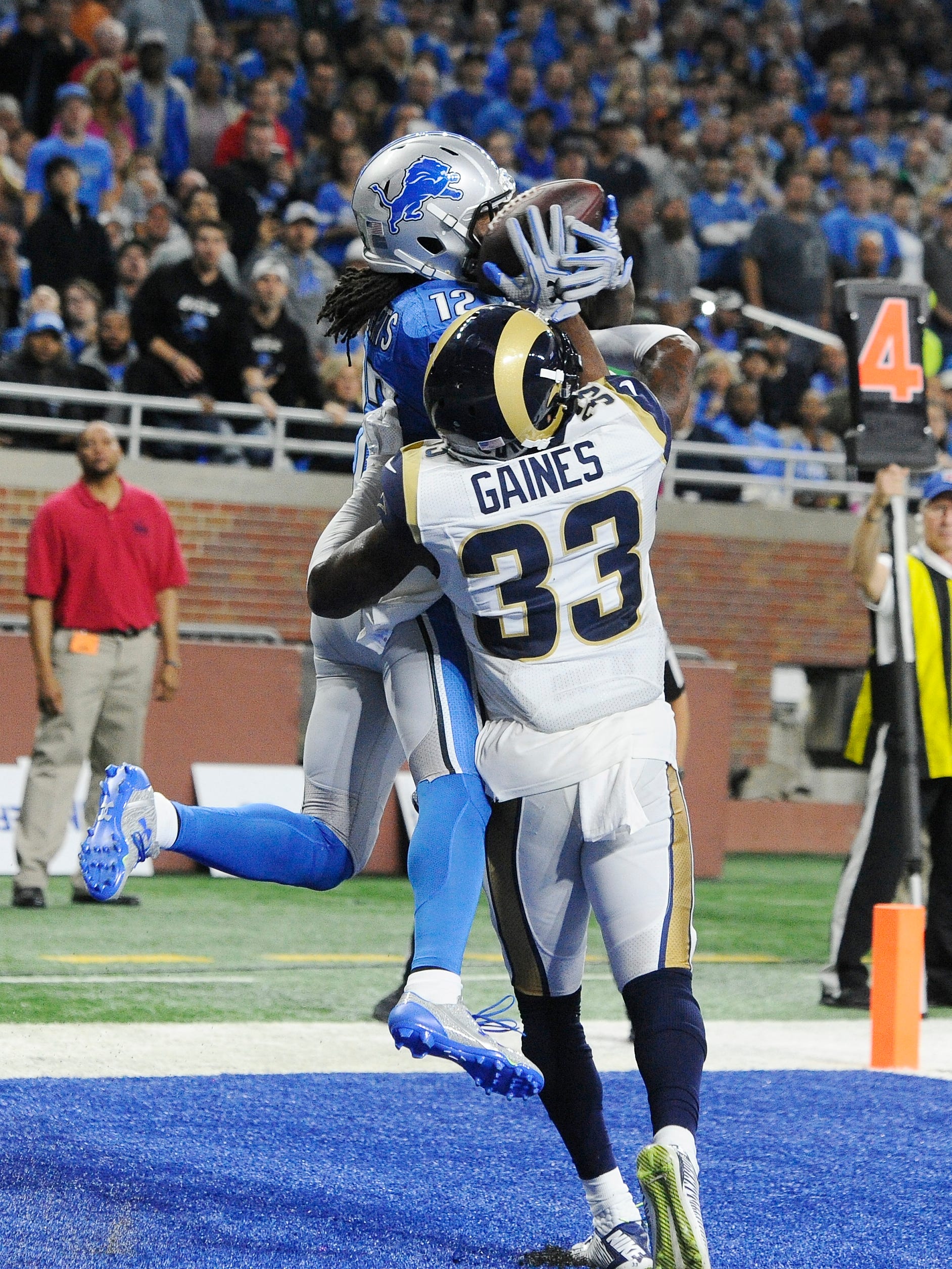 With Rams E.J. Gaines all over him, Lions Andre Roberts pulls in a touchdown reception to tie up the game after the extra point in the second quarter.
