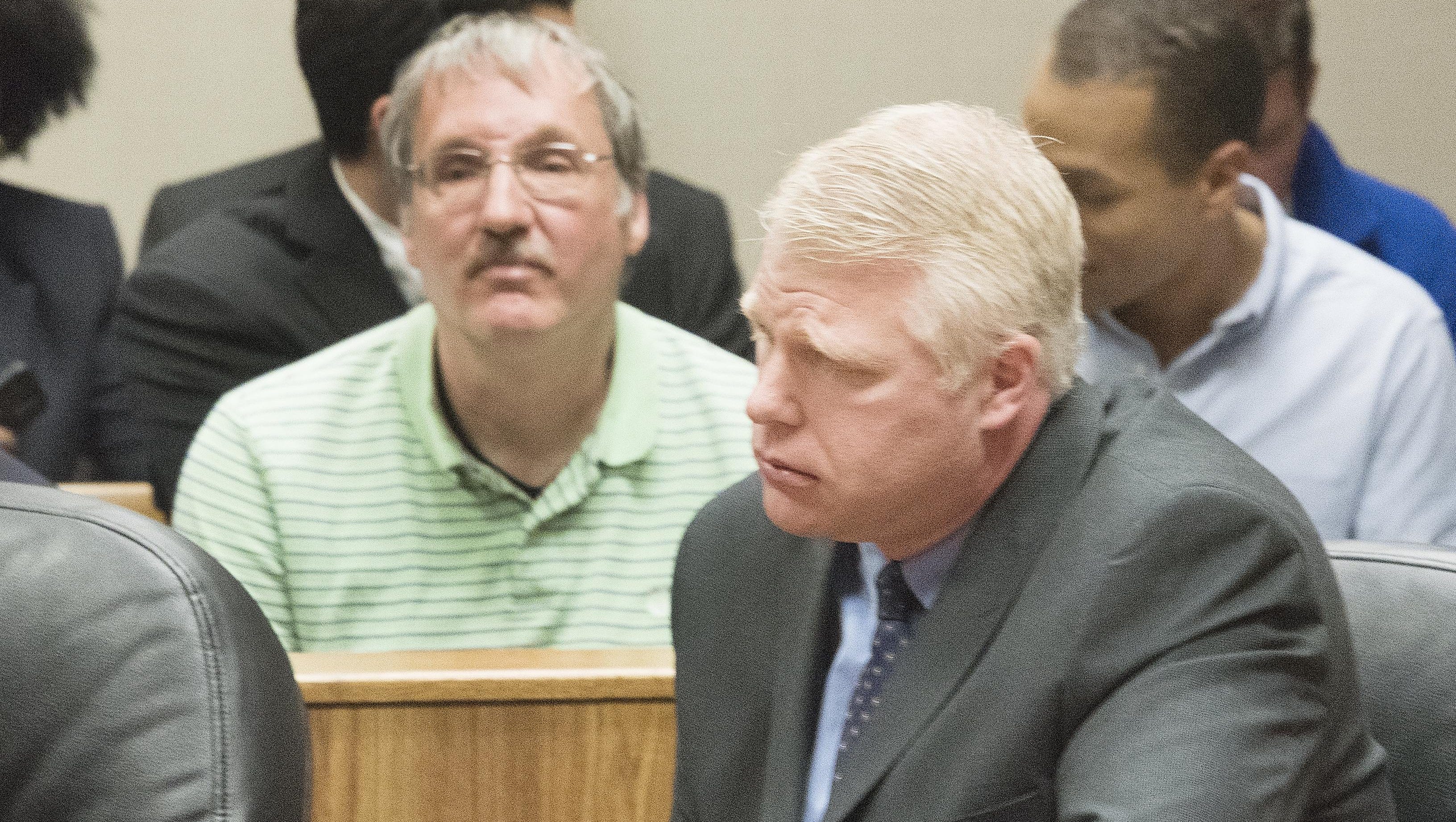 Michael Prysby, Michigan Department of Environmental Quality District 8 Water Engineer, left, and Stephen Busch, Michigan DEQ District 8 Water Supervisor appear in court in this April 20, 2016 file photo. Prysby, Busch and two other state bureaucrats who were among the first charged in the Flint water investigation will get their day in court Monday after at least 18 months of waiting.