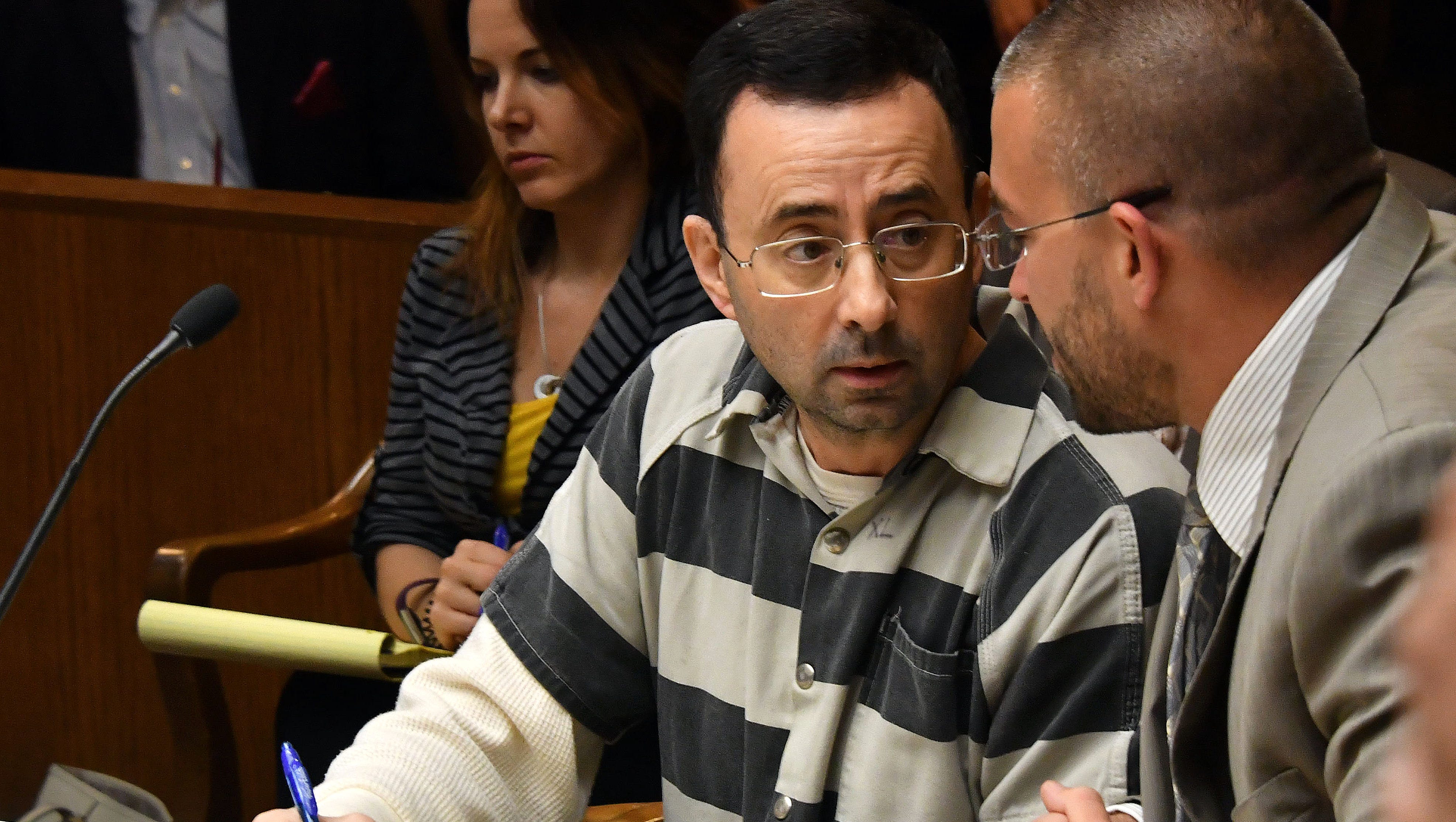 Larry Nassar goes over testimony with attorney Matt Newburg during his pre-trial hearing on May 12, 2017. Nassar is in jail, without bond. He will be sentenced Nov. 27, 2017 in the child porn case, with a prison term ranging from 5 to 60 years.