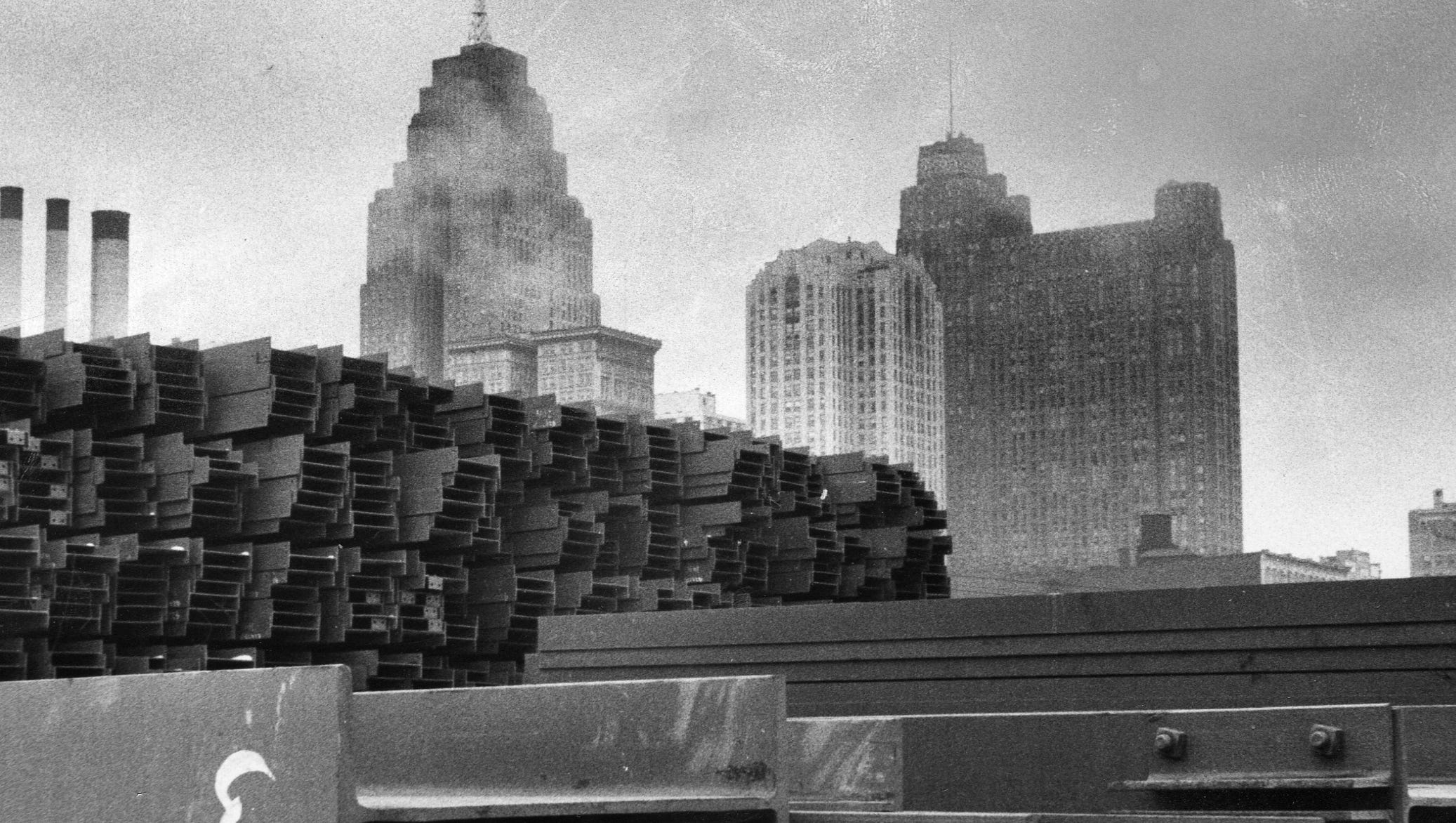Girders rest in front of Detroit skyscrapers during Cobo Hall's construction on Feb. 13, 1958.
