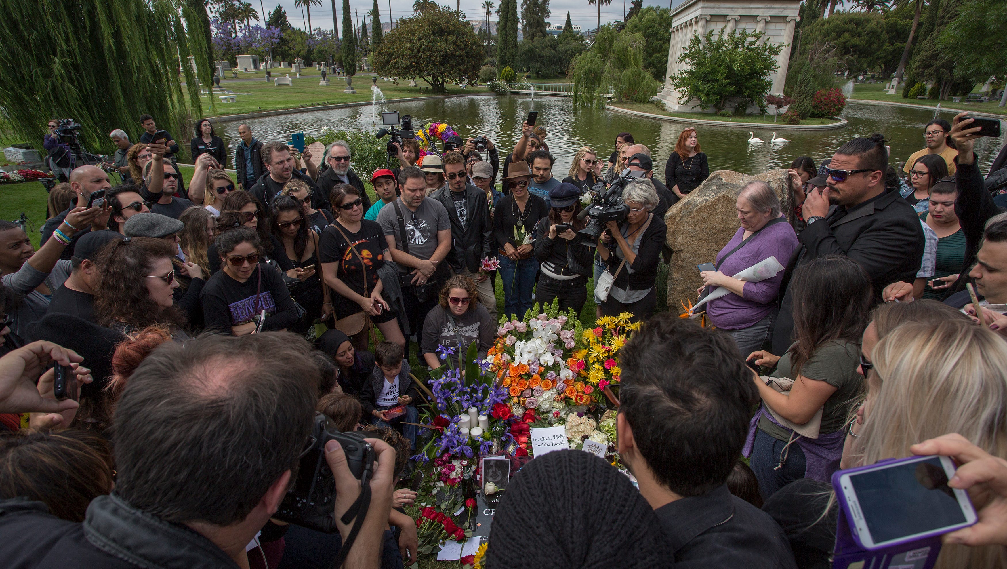 Fans mourn graveside after services for Soundgarden frontman Chris Cornell at Hollywood Forever Cemetery in Los Angeles. The grunge-rock icon was pronounced dead in the early morning hours of May 18 after a Soundgarden performance that evening in Detroit. He was 52.