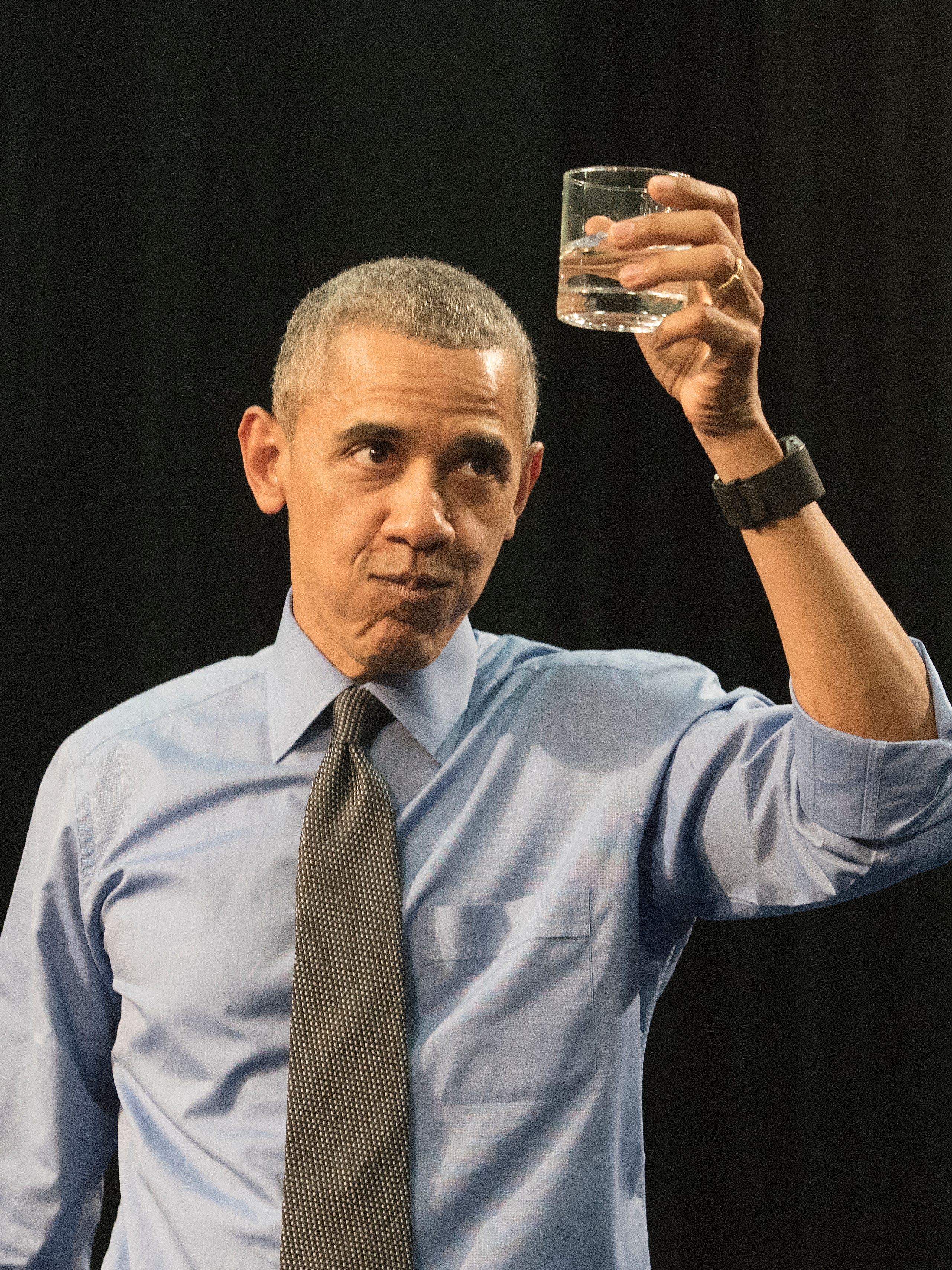 President Obama takes a drink of water he called for while at the podium. "I really did need a glass of water. This is not a stunt," he said.