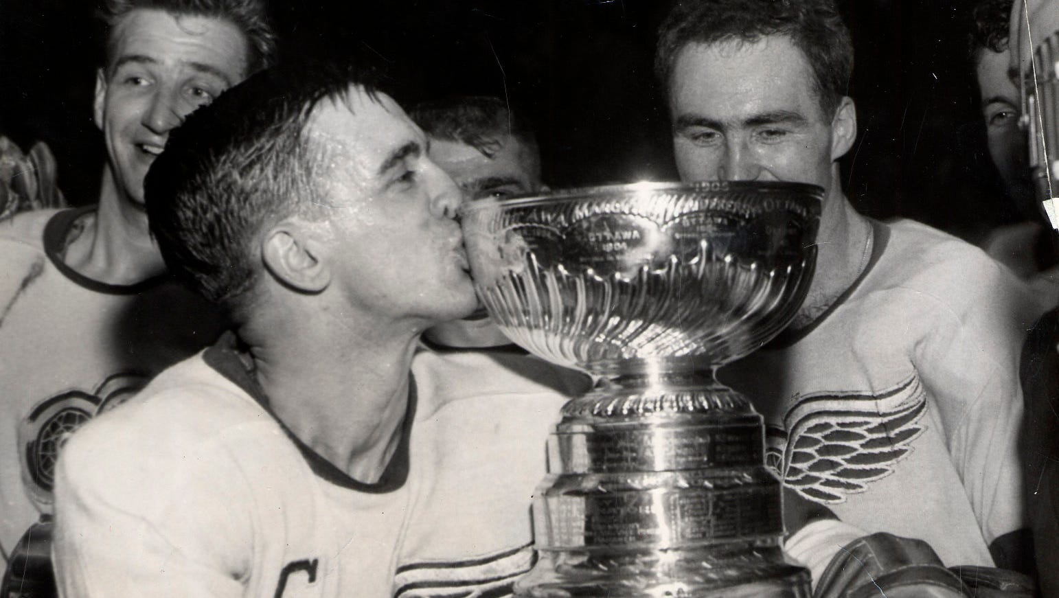 Red Wings captain Ted Lindsay kisses the Stanley Cup in 1955. It was one of four Stanley Cups the small but gritty forward  would win as a Red Wing in his Hall of Fame career.  Lindsay's death was confirmed on March 4, 2019.