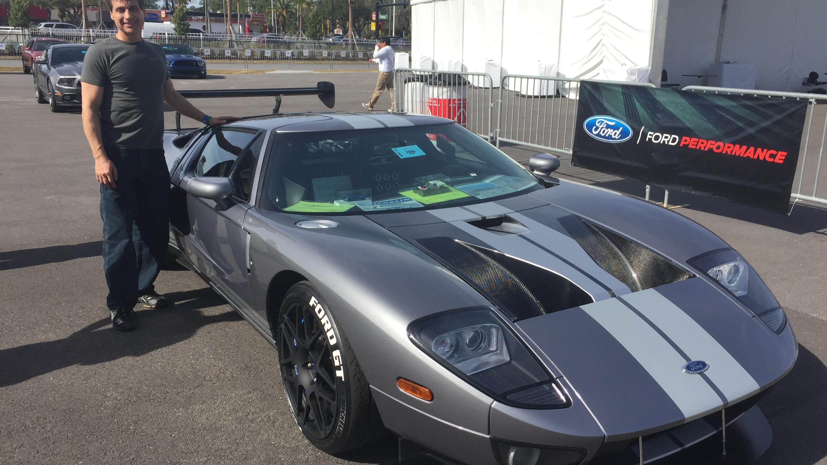 Brian Stormer, 55, stands with his 2006 Ford GT outside the Daytona International Speedway on Saturday. He hopes to be among first 250 owners of the new GT.