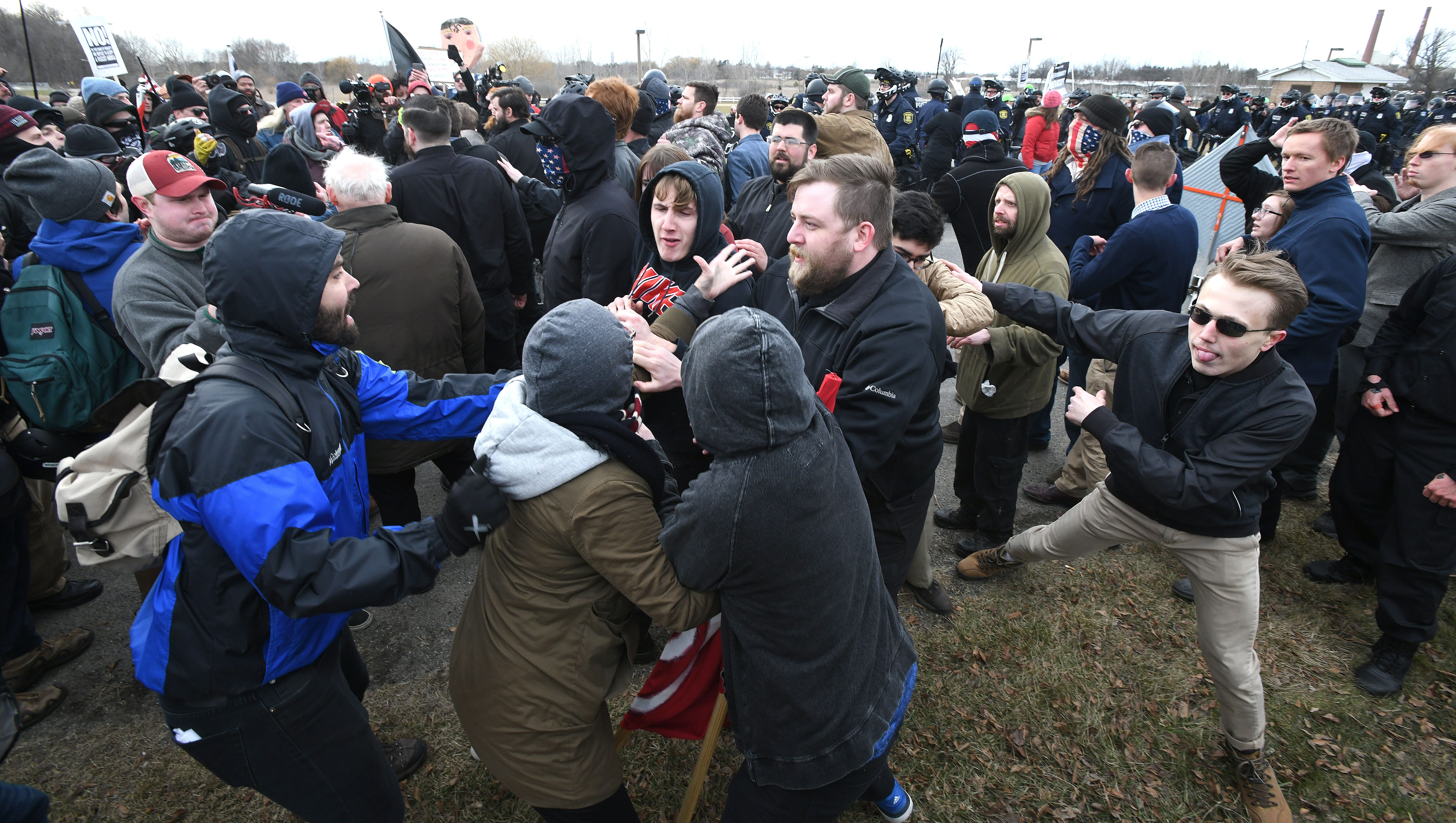 Protesters clash with Spencer sympathizers (right side) outside the MSU Pavilion.