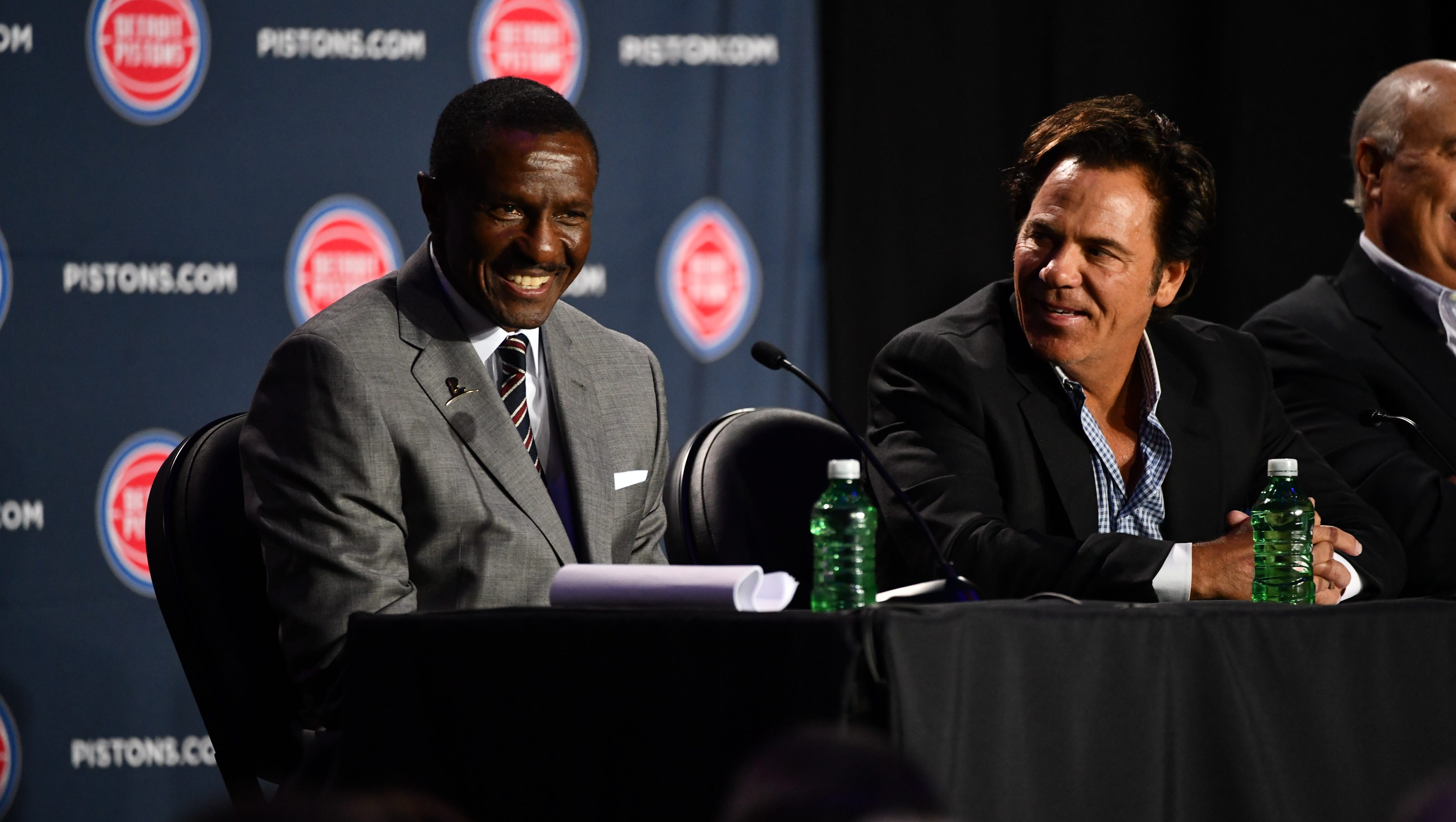 Detroit Pistons team owner Tom Gores, right, helps introduce Dwane Casey as their new head coach Wednesday at Little Caesars Arena in Detroit.
