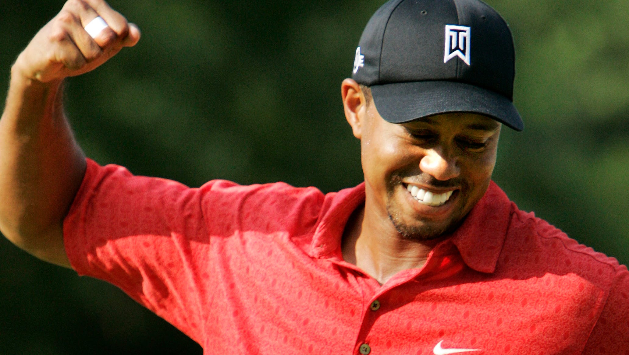 Tiger Woods pumps his fist after winning the 2006 Buick Open. Woods won the tournament three times.